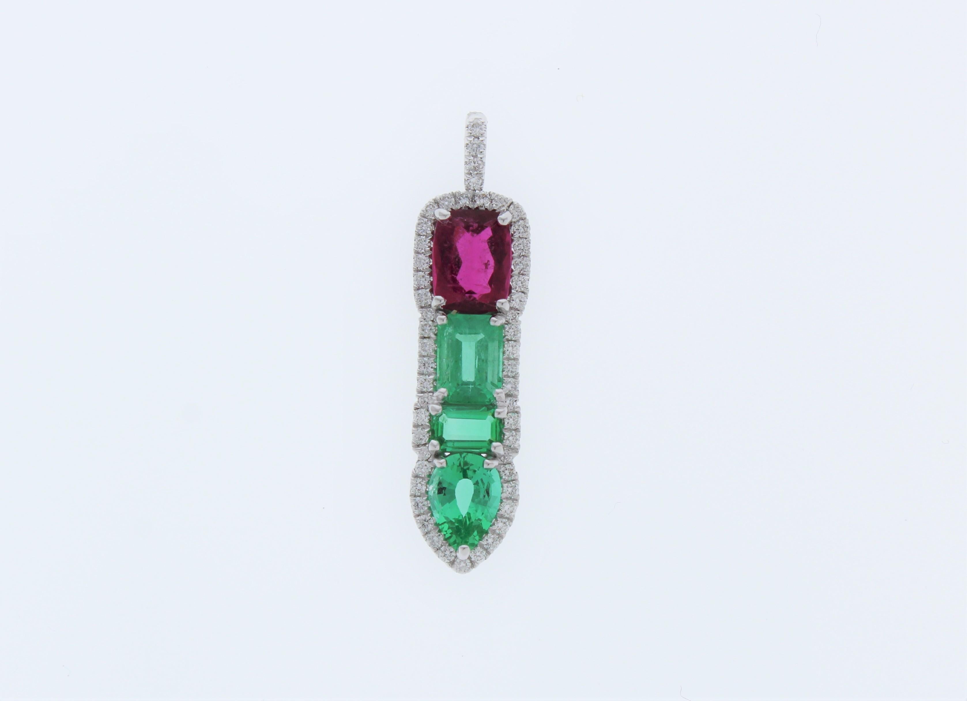 When you present this gorgeous rubellite and emerald 14k White Gold pendant to your favorite lady, she will be completely thrilled! This pendant includes 3.77CTW of Rubellite and Emerald gemstones and Round Diamonds 0.46CTW. This piece is perfect