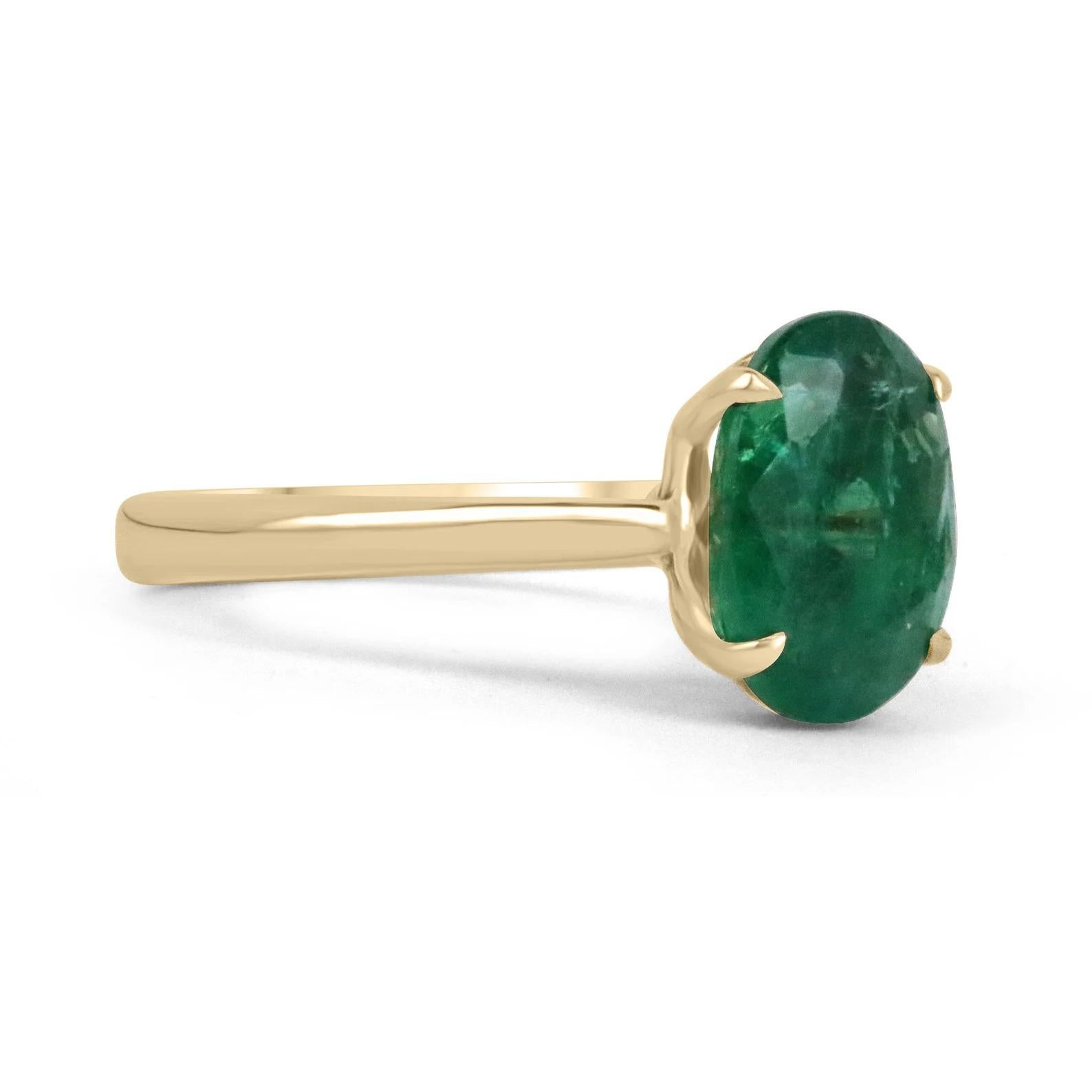 A stunning solitaire emerald ring. This gorgeous piece showcases a ravishing 3.78-carat, natural, fine-quality Zambian emerald. The gemstone displays an enthralling deep, lustrous, emerald green color with remarkable qualities. Securely claw prong