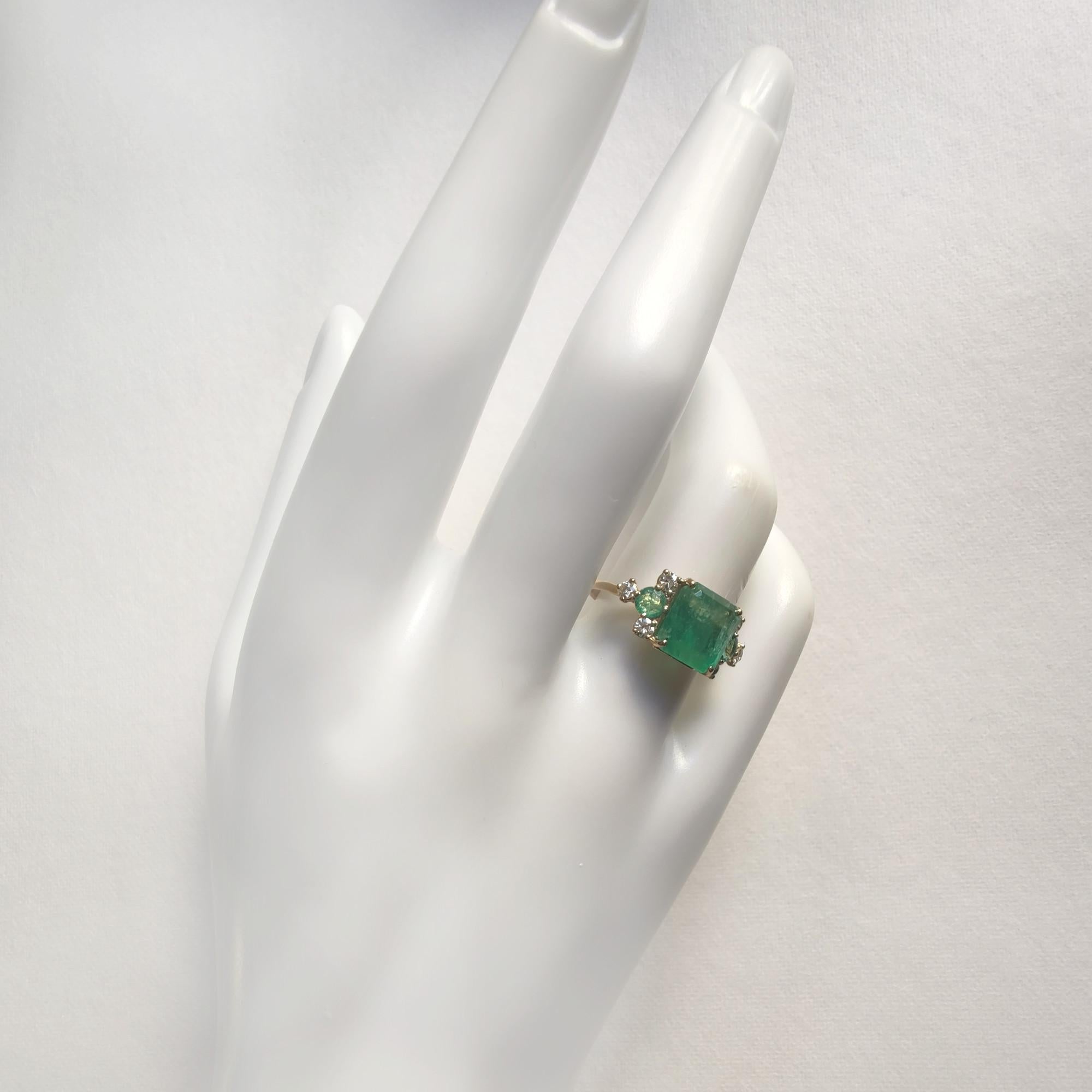 Women's gold ring with natural emeralds and 6 diamonds, handcrafted in a contemporary design. Perfect for engagement gifts, anniversaries, friends, girlfriends, mothers, or Christmas. A timeless jewelry piece, ideal for everyday wear or as a symbol