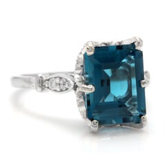 3.78 Carat Natural Impressive London Blue Topaz and Diamond 14 Karat Gold Ring