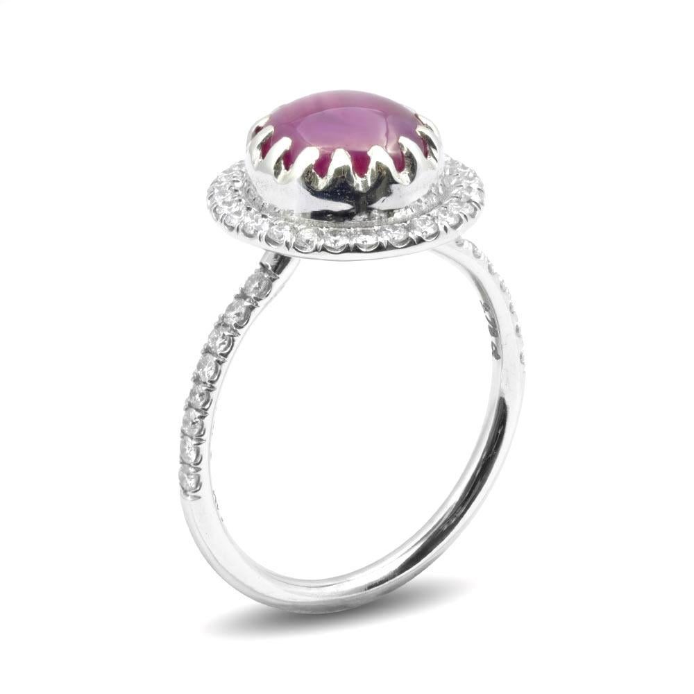 This natural Star Ruby weighing 3.78 carats with a fine 6-rayed star is the embodiment of beauty. Stars that are formed by minute internal characteristics called silk gives this gem its character and phenomena. Set in a handcrafted 14K white gold