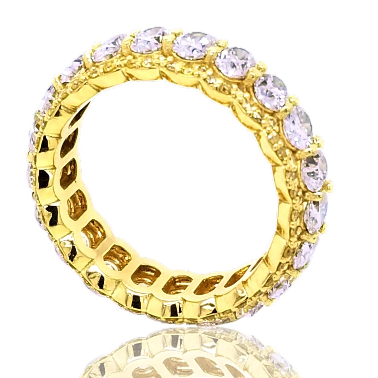 This beautiful Eternity Ring is made of 18K Yellow Gold with 21 perfectly matched (VS/E-F) 0.15 Ct each Oval Brilliant Diamonds Set in Shared Prong Mode with Pave Set Fancy Yellow Round Brilliant diamonds on the edge..
Total Weight of Oval diamonds: