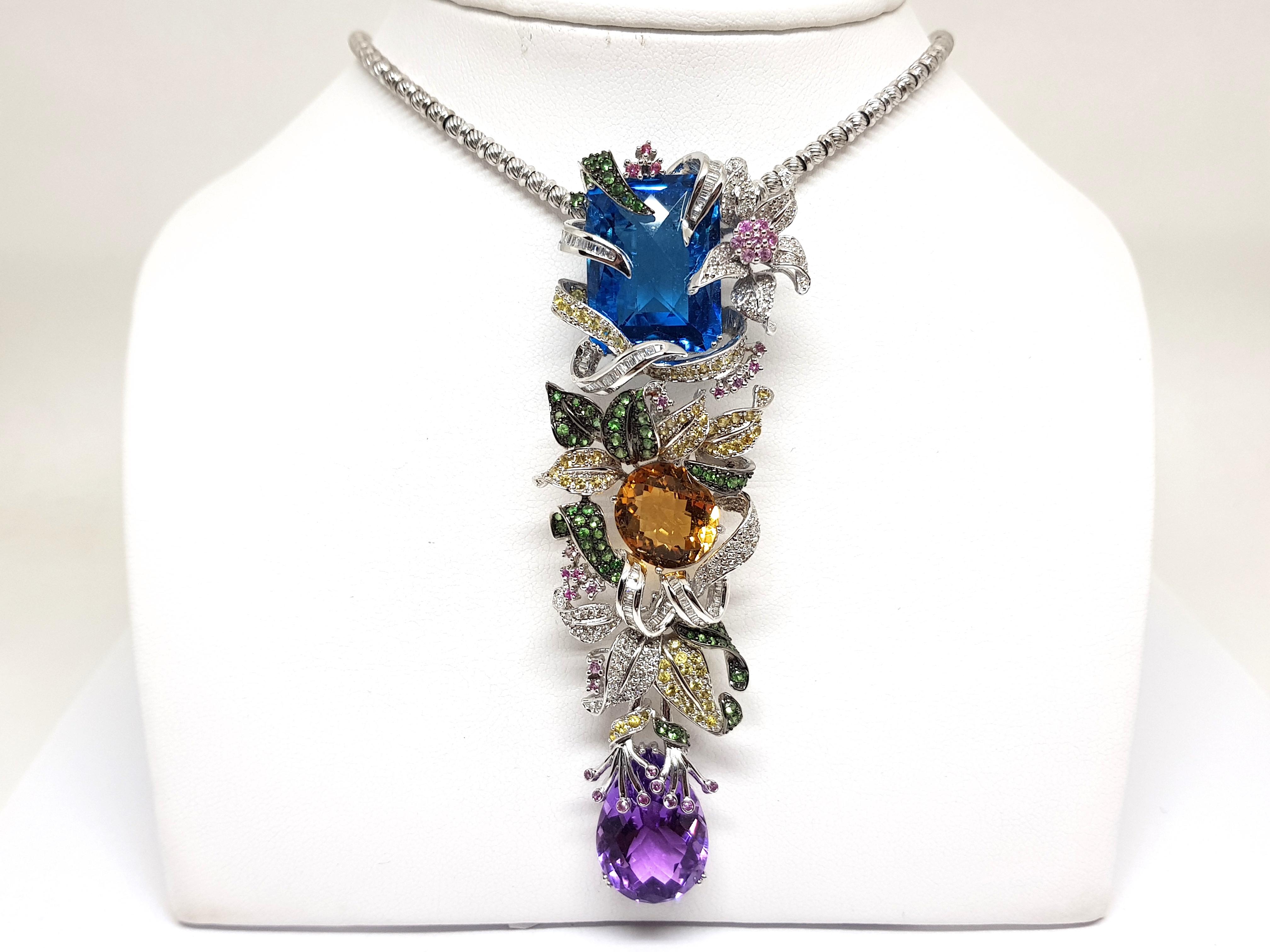 Gold: 18K White Gold. 
Weight: 42.84 gr. 
Diamonds: 5.59ct. Colour: G Clarity: VS 
Topaz: 16.10ct. 
Citrine: 5.11ct. 
Amethyst: 6.96ct. 
Emeralds: 1.70ct. 
Yellow Sapphires: 1.68ct. 
Pink Sapphires: 0.66ct. 
Length Pendant: 9.7 cm. 
Width Pendant: