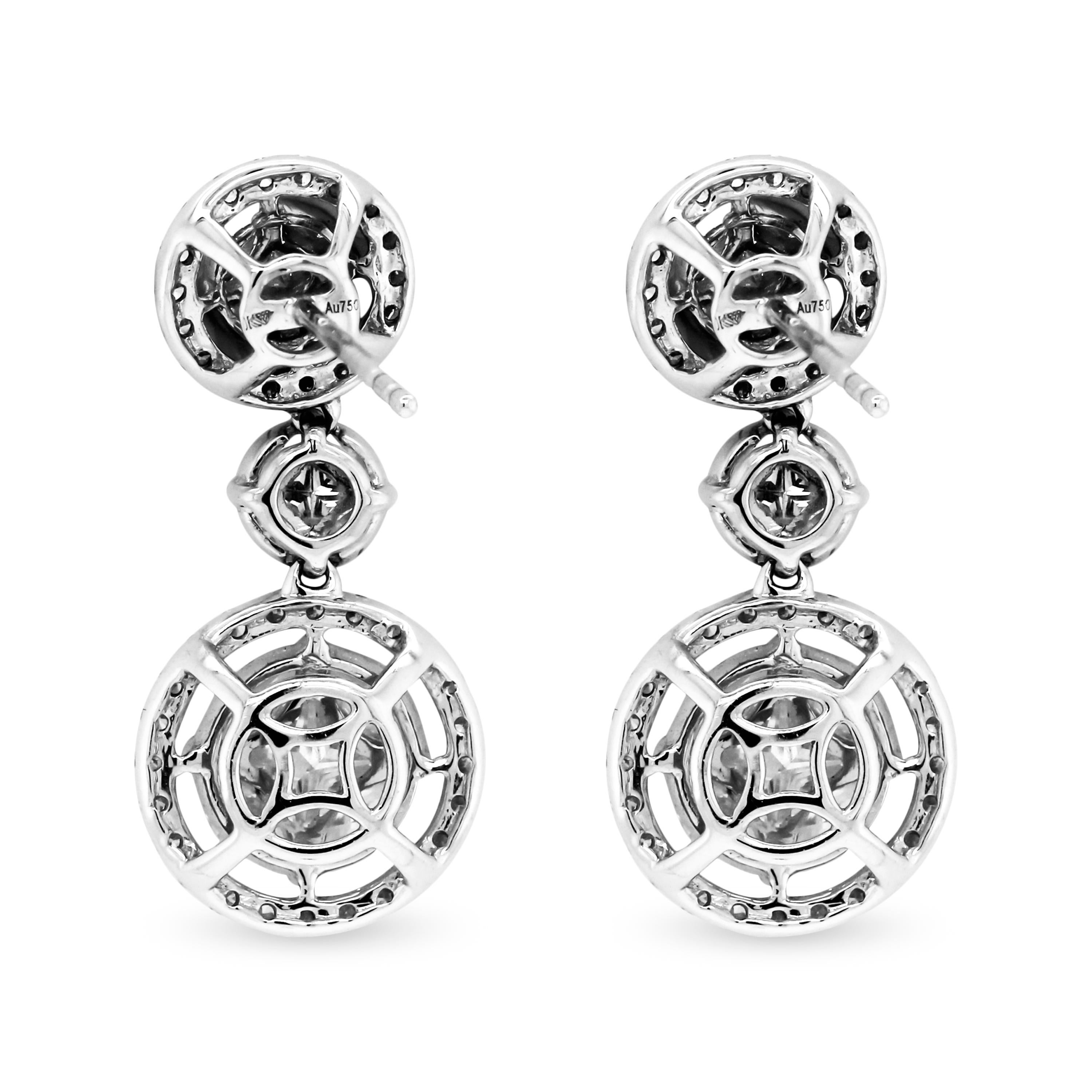 3.79 Carat Round and Marquise Diamond 18K White Gold Dangle Drop Earrings

The marquise stones are set on the edges with a round diamond in the center to give an illusion of one large stone.

3.79 carat G color, VS clarity diamonds total