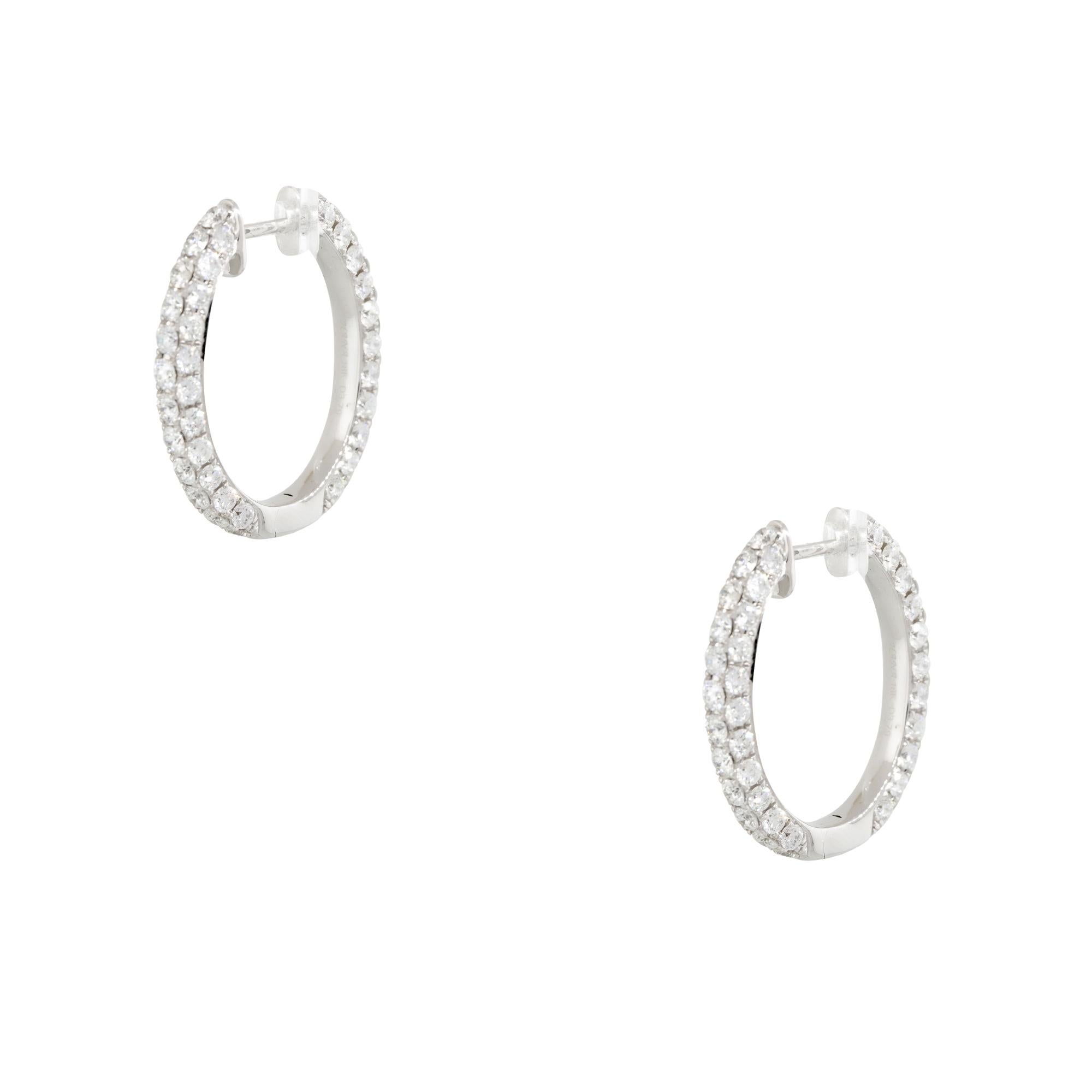 18k White Gold 3.79ctw Round Brilliant Diamond Hoop Earrings
Material: 18k White Gold
Diamond Details: Approximately 3.79ctw of Round Brilliant cut Diamonds. Diamonds are set in rows across 3 sides of the hoop earrings. The diamonds are not set