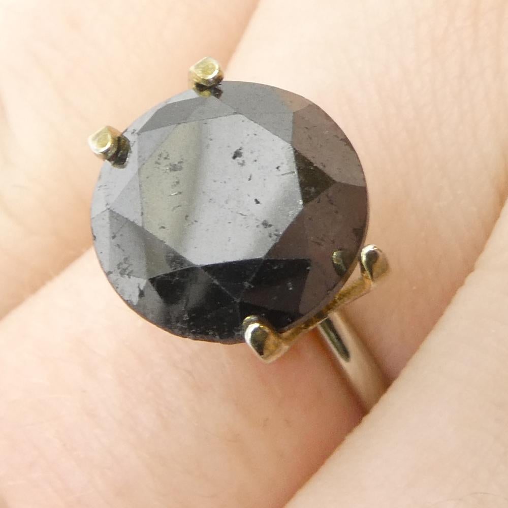 Description:

Gem Type: Diamond 
Number of Stones: 1
Weight: 3.79 cts
Measurements: 10.33 x10.33 x 5.32 mm
Shape: Round
Cutting Style Crown: Brilliant Cut
Cutting Style Pavilion: Brilliant Cut 
Transparency: Opaque
Clarity: N/A
Colour: Black
Hue: