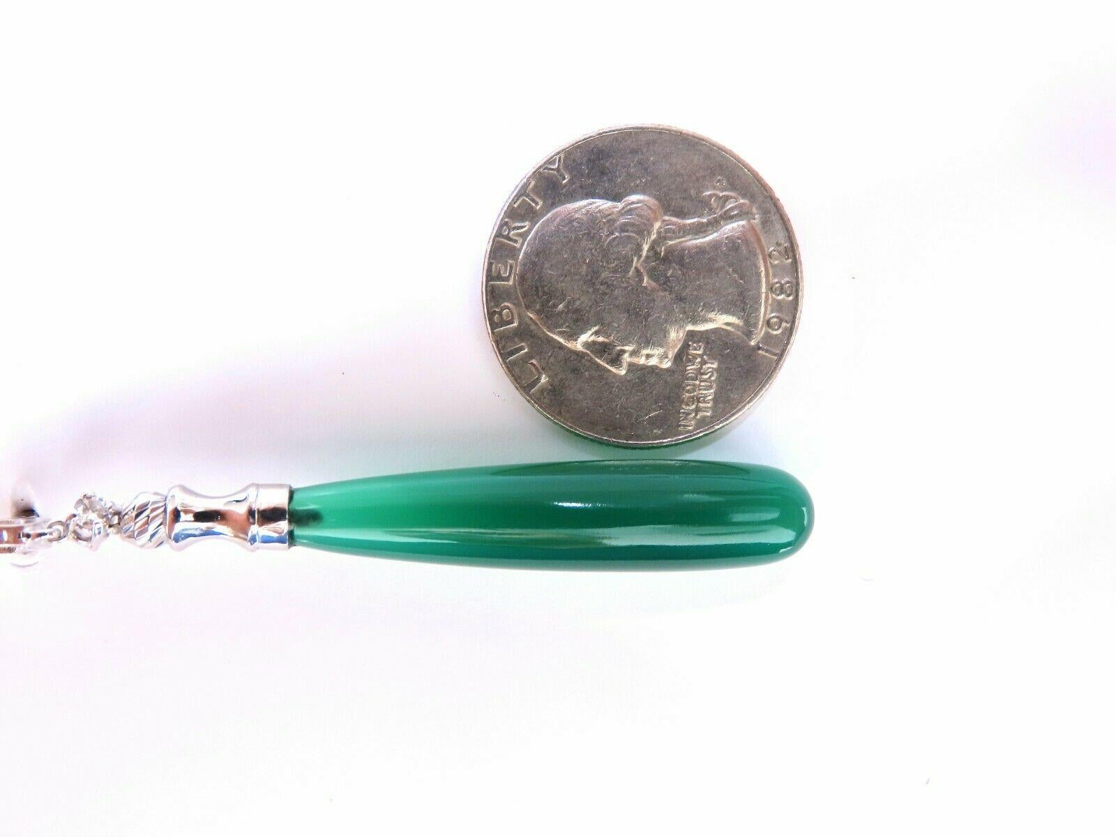 Extra long sleek Jade drop dangle earrings

Natural matching green jade.

37x8.2 mm

.30 carat round brilliant cut natural diamonds.

G color vs2 clarity

14 karat white gold 12.2 g

Earrings measure 2.6 inch long
