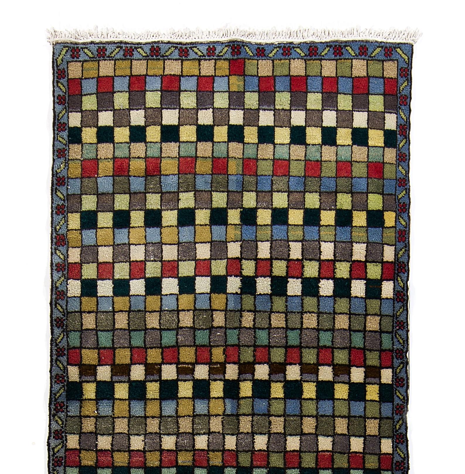A handmade mid-century 'Tulu' (Turkish word for 'thick piled') runner rug from Konya in Central Turkey. The rug is made of 100% wool, therefore it is very soft and comfortable. Measures: 3.7x12.5 ft.

These simple rugs with geometric modern