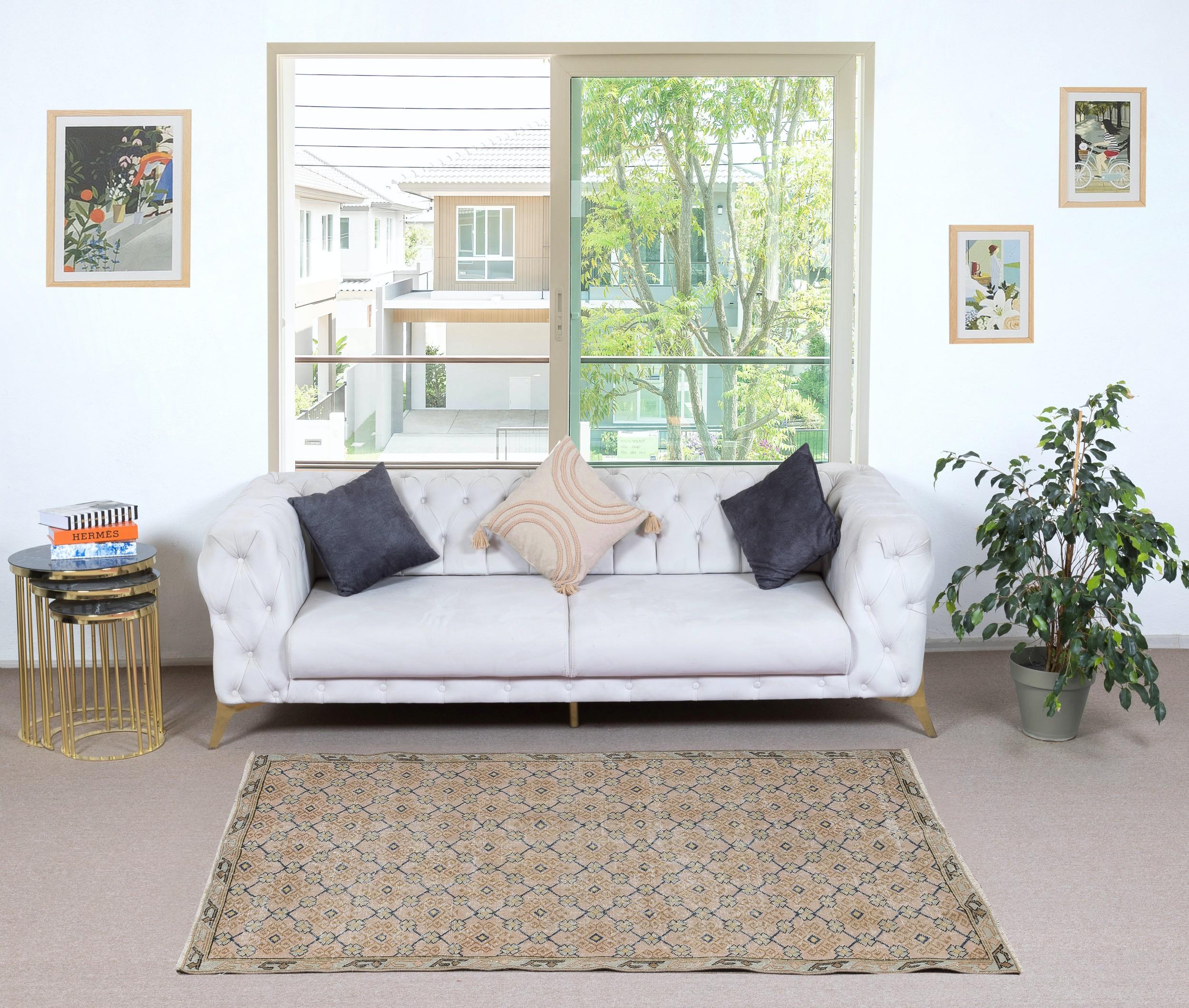Infuse your home with the timeless beauty of this traditional vintage handmade Turkish rug, a hand-knotted masterpiece crafted from a luxurious blend of wool and cotton. Woven by skilled artisans using centuries-old techniques, this rug features