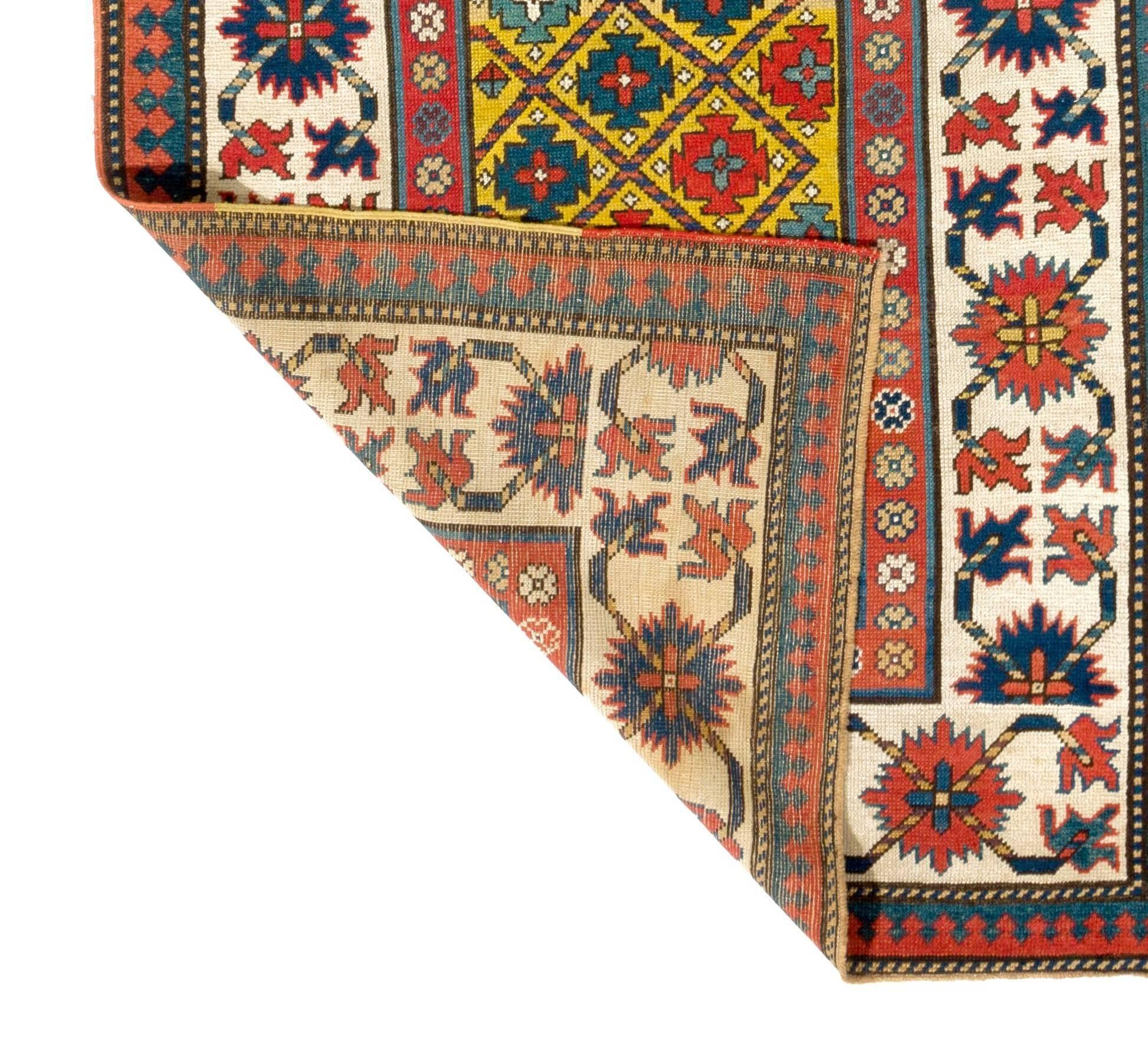 A truly outstanding antique South East Caucasian rug in well preserved condition and with saturated natural dyes including the abrash, the changes in the color tone on the yellow field which is all original. 
Size: 3.7 x 8.9 Ft.