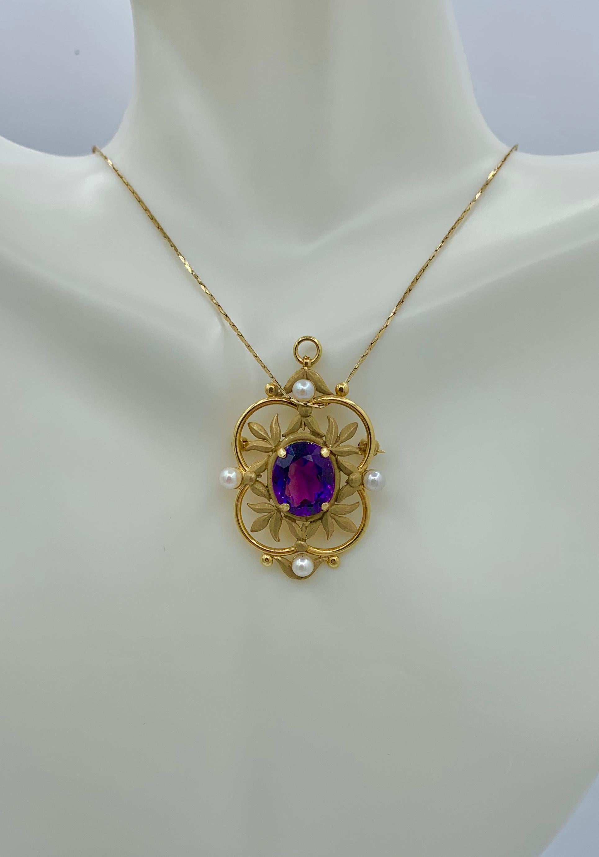 THIS IS A STUNNING VICTORIAN EDWARDIAN 3.8 CARAT OVAL FACETED SIBERIAN AMETHYST AND PEARL LAVALIERE PENDANT WITH THE MOST GORGEOUS NATURAL OVAL FACETED AMETHYST GEM SURROUNDED BY A GORGEOUS OPEN WORK LEAF MOTIF DESIGN IN GREEN GOLD WITH FOUR ELEGANT
