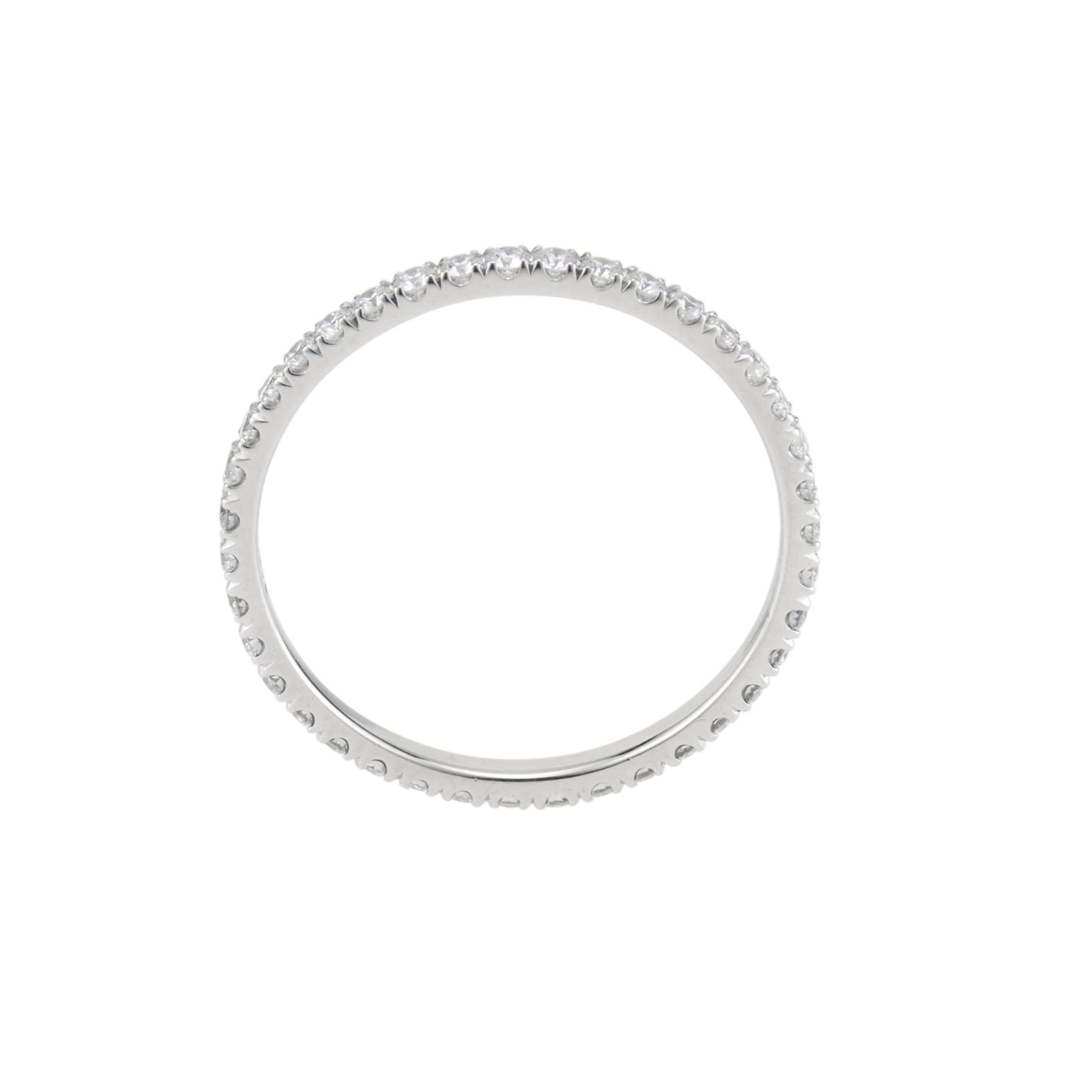 Eternity band wedding ring with .38 carats of bright full cut diamonds in 14k white gold setting. 

38 round brilliant cut diamonds, G VS approx. .38cts
Size 5 and not sizable 
14k white gold 
Stamped: 14k
.8 grams
Width at top: 1.45mm
Height at
