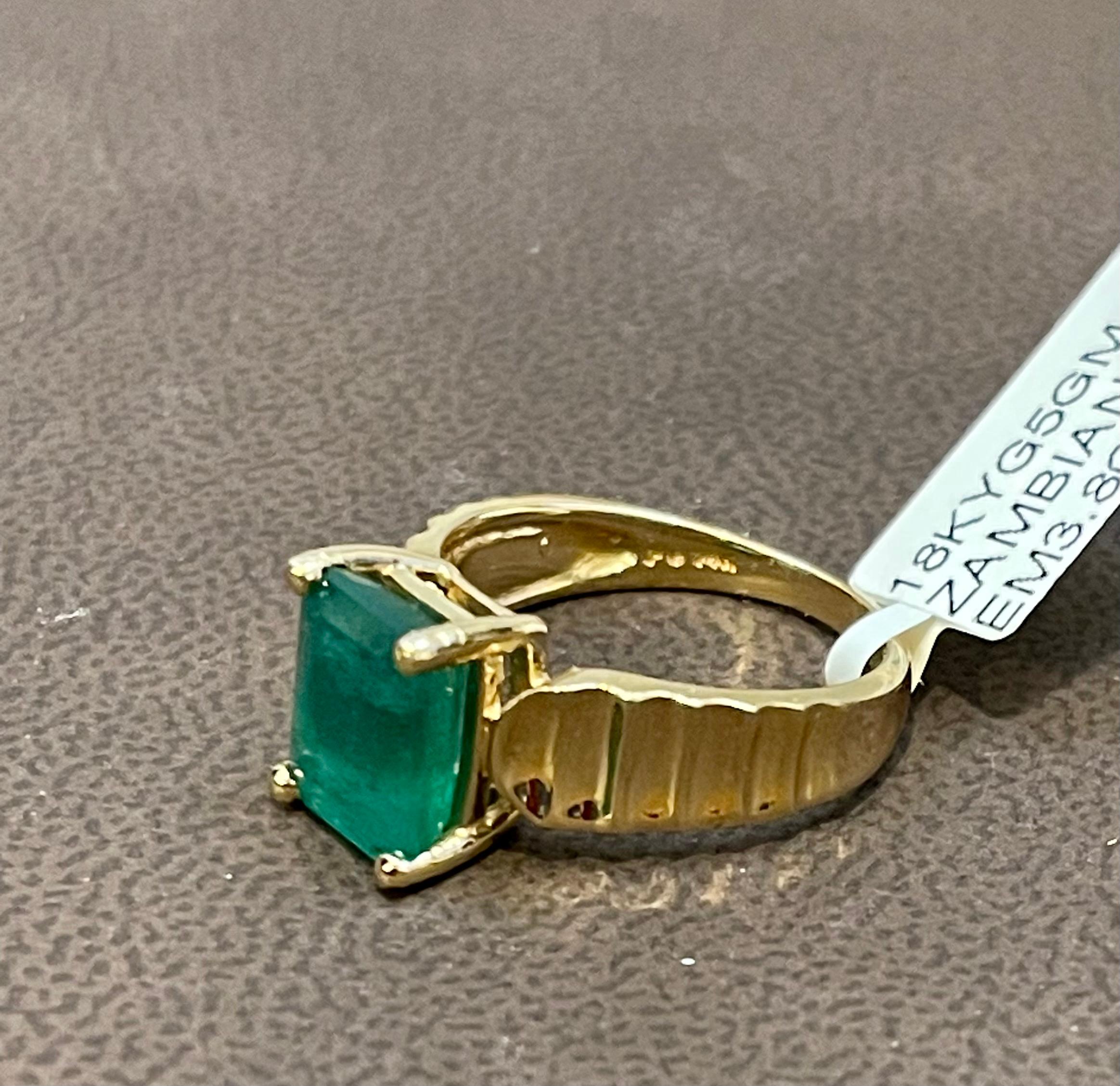 3.8 Carat Natural Zambian Emerald Cut Emerald Ring 14 Karat Yellow Gold In Excellent Condition For Sale In New York, NY