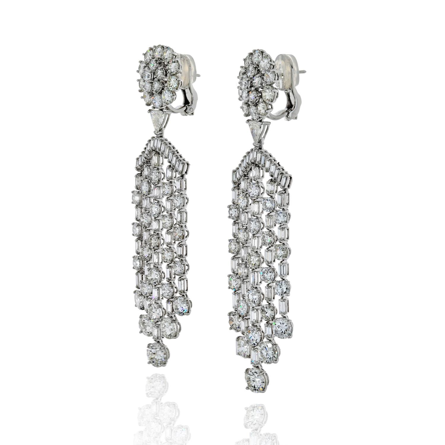 A stunning cascade of round and baguette-cut diamonds forming a dramatic chandelier drop earring that will turn heads.

Length measures approximately 83mm from top to bottom, and approximately 24mm wide.
These gorgeous chandelier earrings have