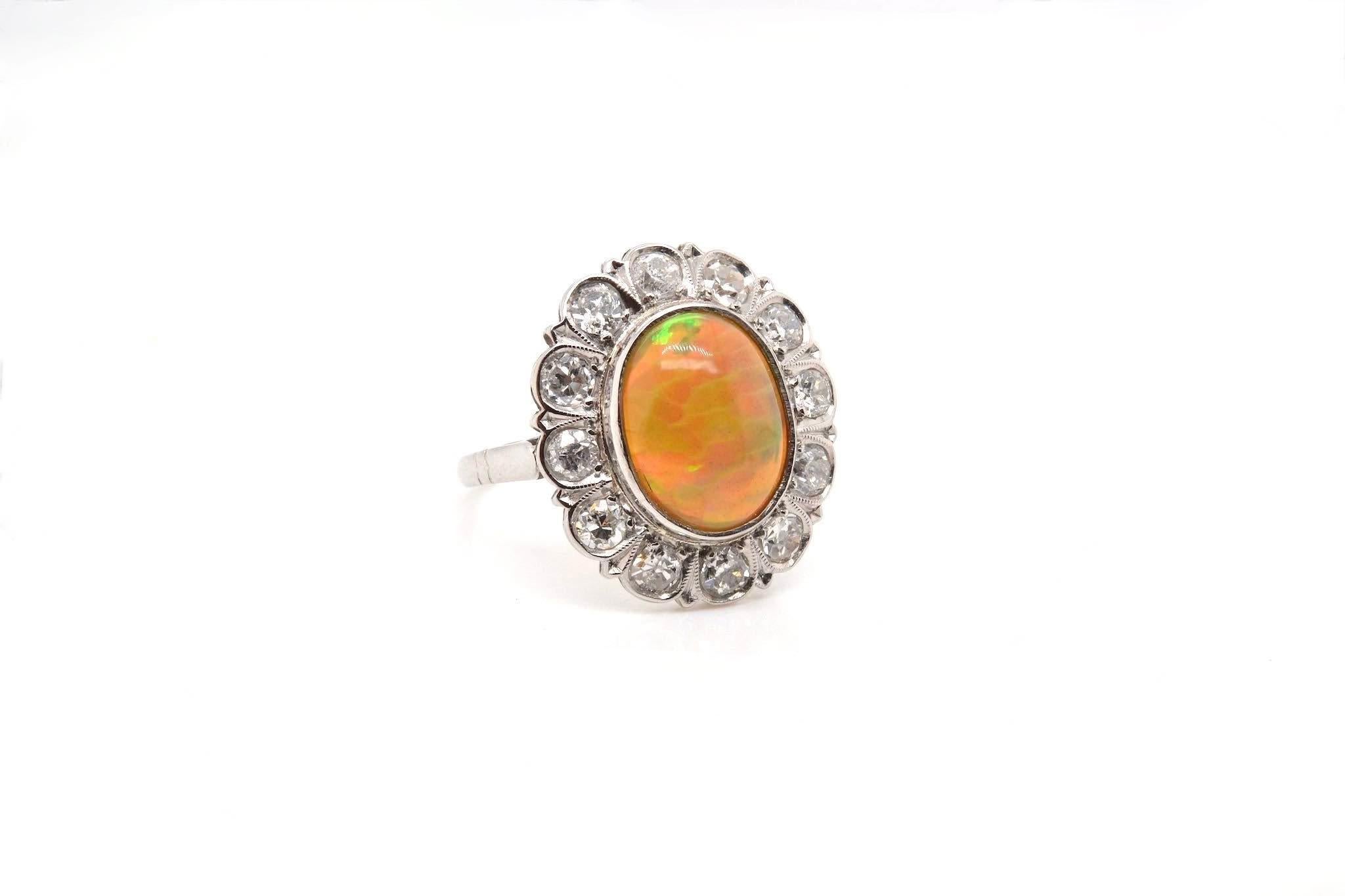 Cabochon 3.8 carats australian opal and diamonds ring in 18k gold For Sale
