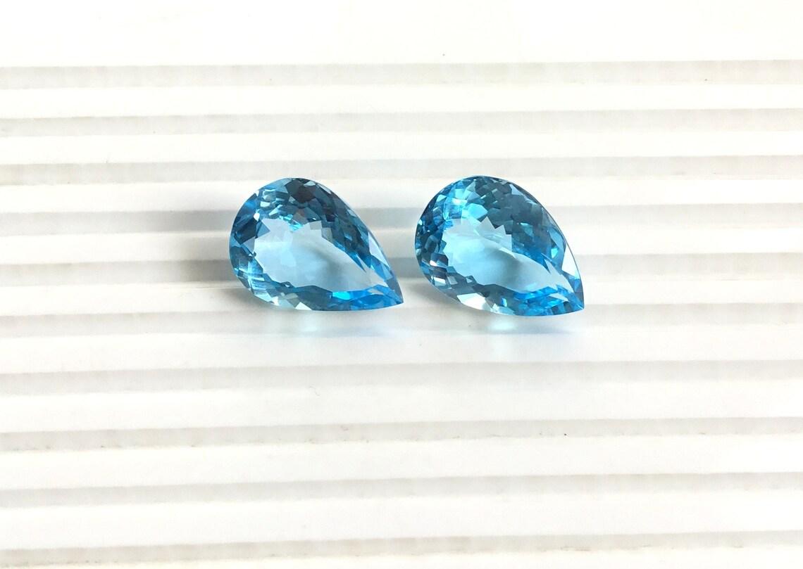 Women's or Men's 38 Carats Blue Topaz Pear Pair Natural Gemstone 2 Piece Faceted Earrings Gem For Sale
