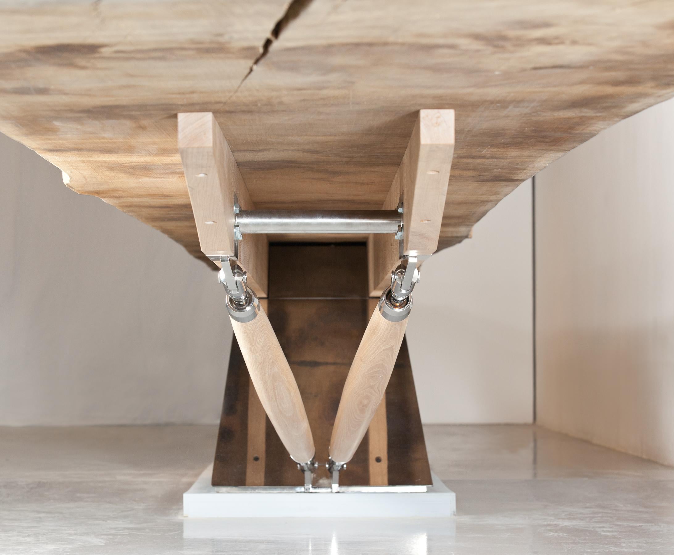 The ‘Tree’ table is an astonishing 38 feet (11.5m) long and made from a single plank of European oak ‘balanced’ on a mirror polished stainless steel pyramid. 

Made by renowned English furniture maker, Benchmark, the design is derived from the