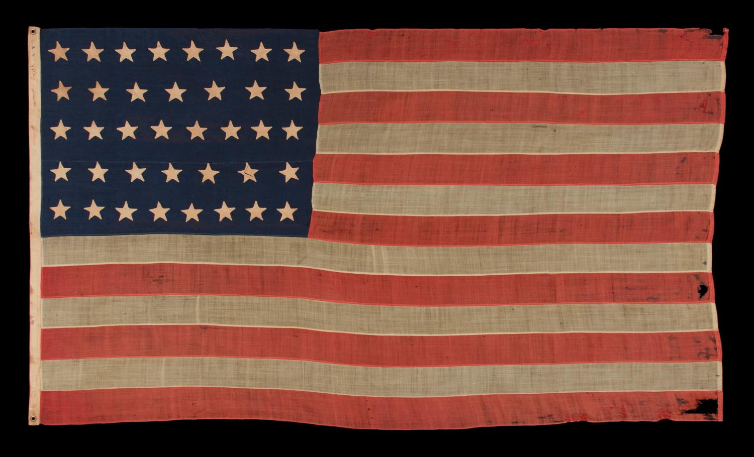 38 HAND-SEWN, SINGLE-APPLIQUÉD STARS ON AN ANTIQUE AMERICAN FLAG MADE AT THE TIME WHEN COLORADO WAS THE MOST RECENT STATE TO JOIN THE UNION, 1876-1889, FORMERLY PART OF THE MASTAI COLLECTION: 

38 star American national flag with important
