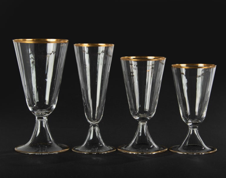 Beautiful set of crystal glasses, made by the Belgian brand Val Saint Lambert. The name of the model is Lyon. The glasses are slightly ribbed and decorated with subtle gold-coloured edges. The glasses are all in good condition. Not signed, but it is