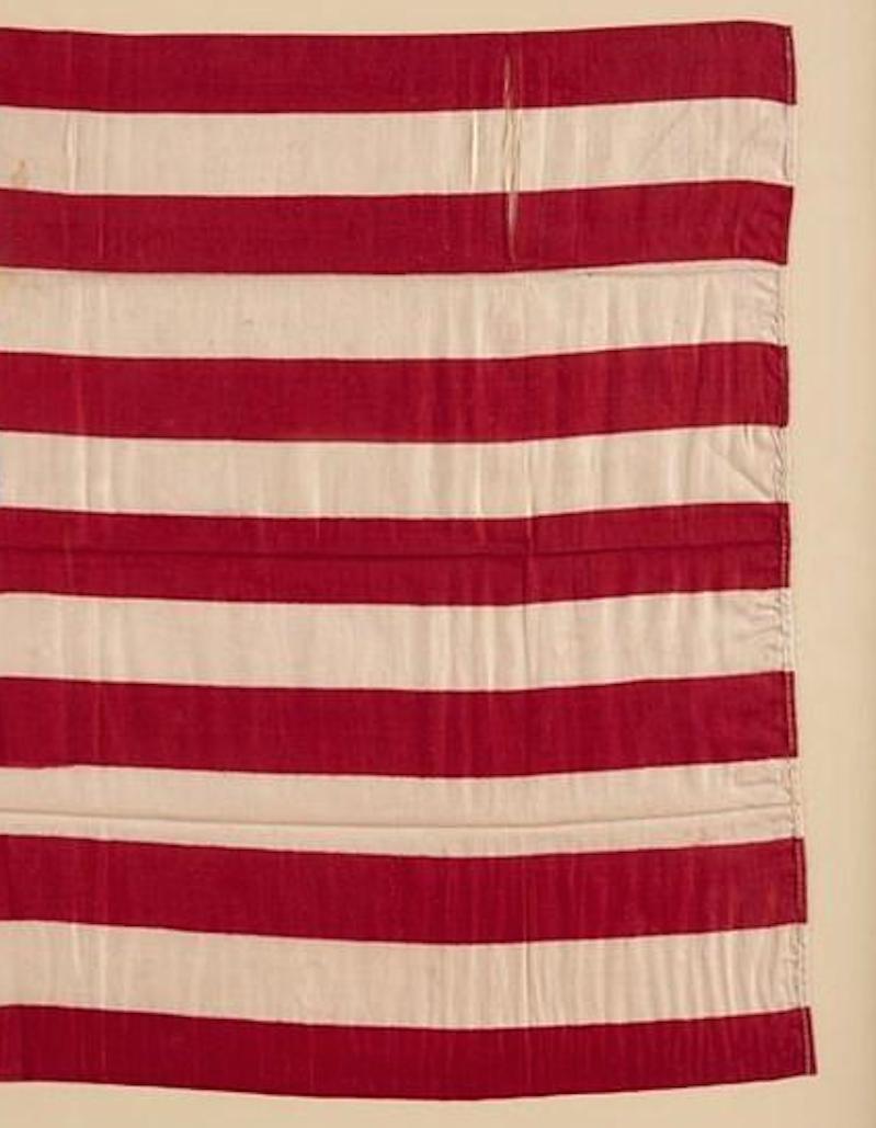 This is an exceptional 38-star printed silk American flag. The flag dates to 1876-1890, when Colorado joined the Union as the 38th state. A wonderful celebration of the nation's early history, this flag is an authentic antique.

This printed flag