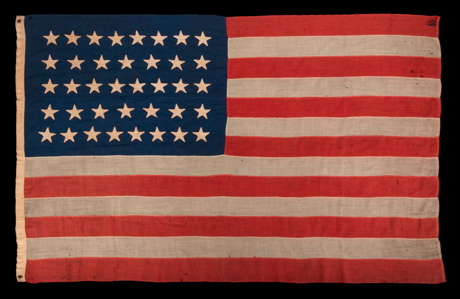 38 Star Antique American Flag with Hand-sewn Stars in an 8-7-8-7-8 Pattern of Justified Rows, Made in the Period When Colorado was the Most Recent State to Join The Union, 1876-1889:

38 star American national flag, with pencil-inscribed names of