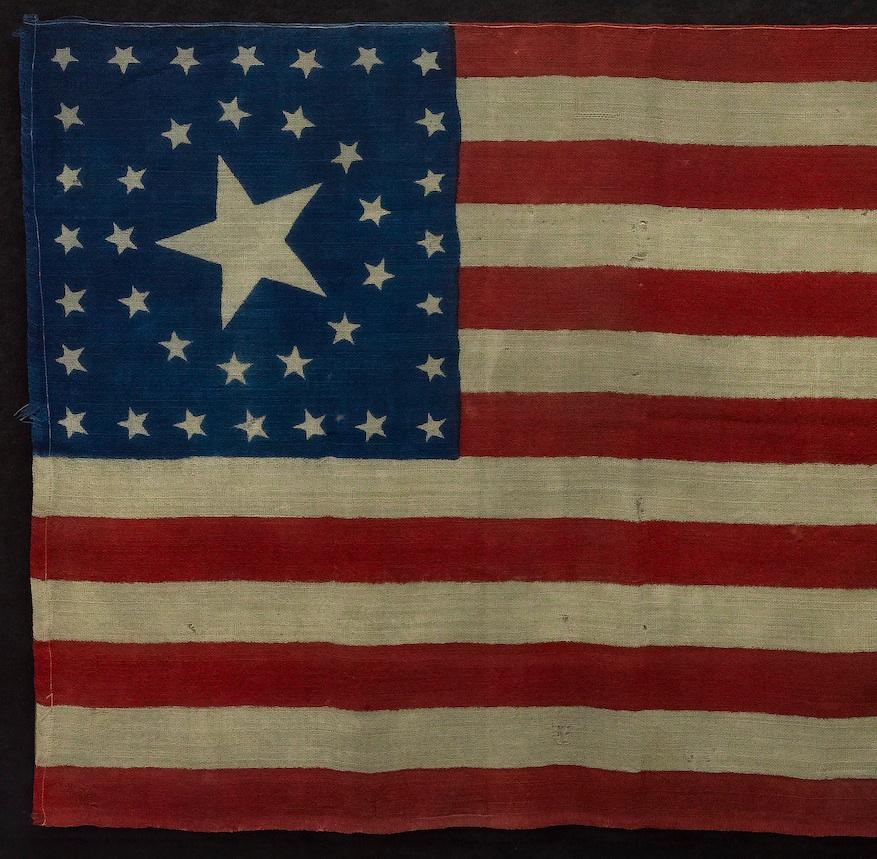 This is a striking original 38-star United States flag. The flag dates to 1876, when Colorado (represented by the large star in the center of the flag’s canton) joined the Union as the 38th state. A wonderful celebration of our nation's early