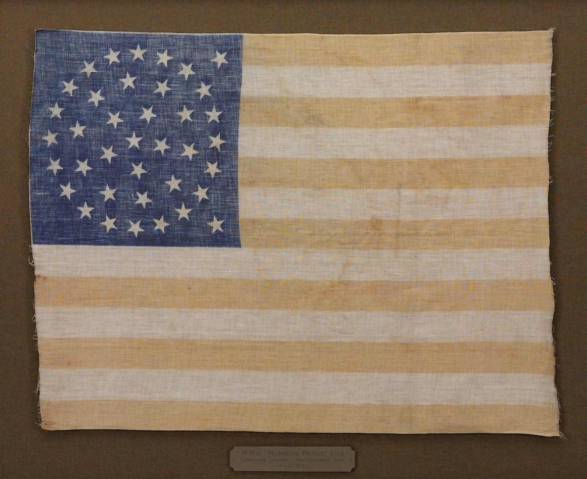 This is a striking original 38-star United States flag. A wonderful celebration of our nation's early history, this flag is an authentic antique, dating circa 1877-1890.

In lead up to the nation’s Centennial, flag makers looked to the past for