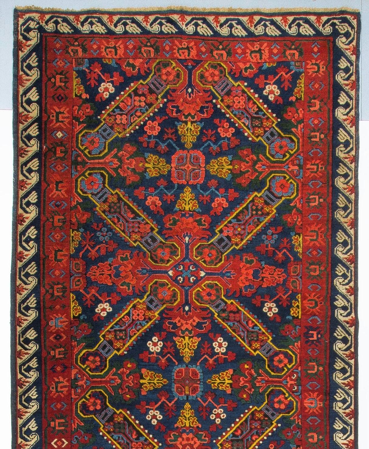 A beautifully preserved antique Seychour rug, from a highly sought after family of rugs from the Kuba region of Azerbaijan, hand-knotted in the 19th century. It features prominent, elaborate St Andrews crosses across its field, which is a