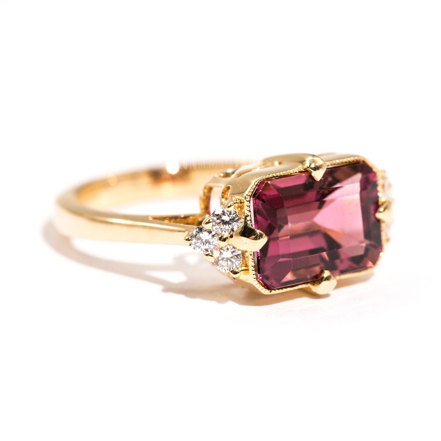 Forged in 18 carat yellow gold is this uniquely designed vintage inspired ring that features an alluring 3.80 carat bright reddish purple emerald cut tourmaline complimented by a total of 0.20 carats of sparkling round brilliant cut diamonds. We