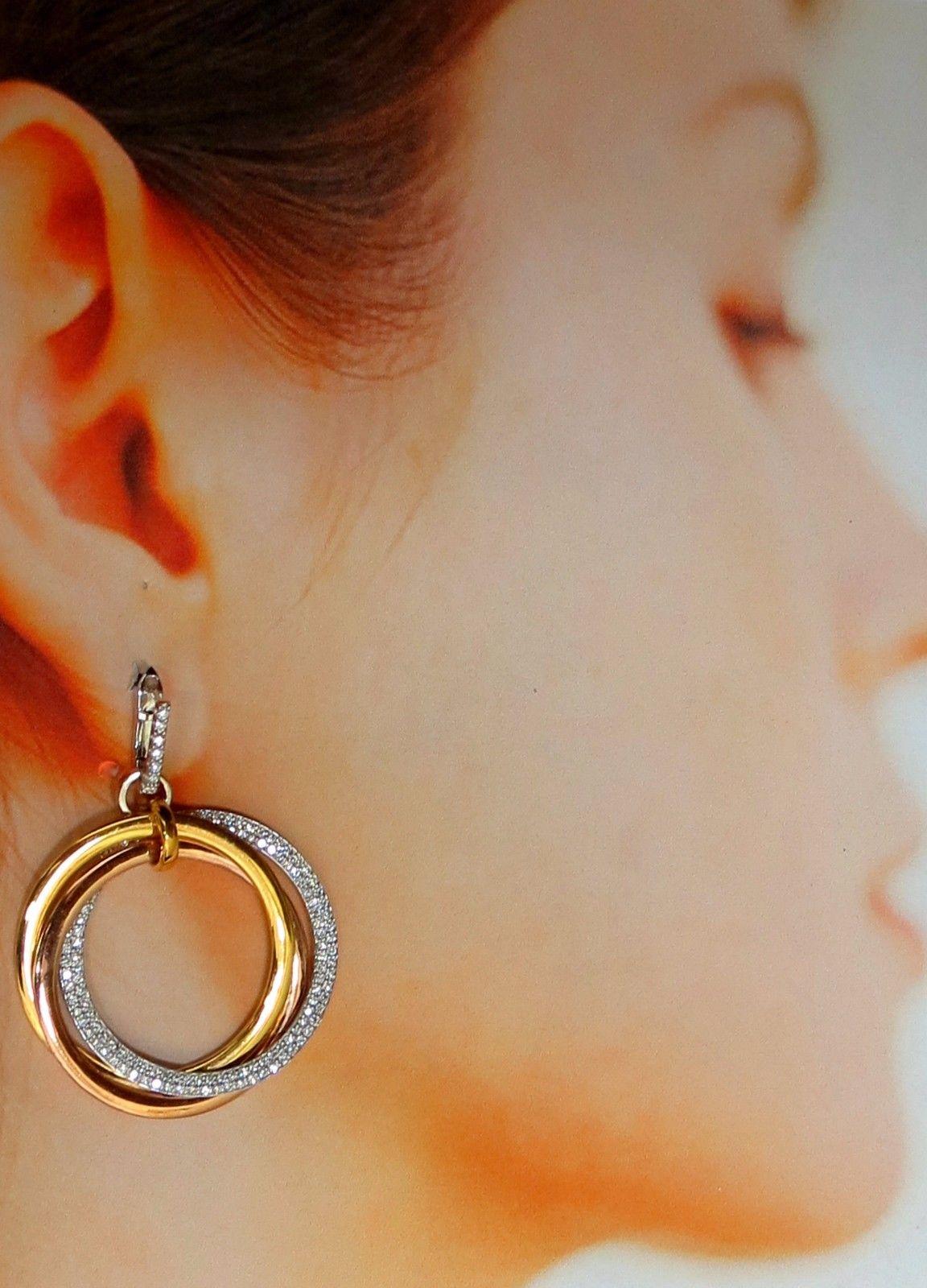 Large Rolling Rings circle loop earrings.

The Modern Dangle.

3.80cts of natural round diamonds: 

G-color, Vs-2 clarity.

14kt. white / yellow / rose gold

26.9 grams.

Earrings measure: 1.96 inch long 

1.3 inch diameter on each ring

Comfortable