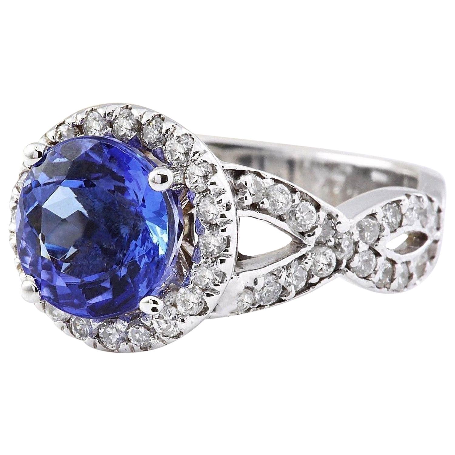 3.80 Carat Natural Tanzanite 14K Solid White Gold Diamond Ring
 Item Type: Ring
 Item Style: Engagement
 Material: 14K White Gold
 Mainstone: Tanzanite
 Stone Color: Blue
 Stone Weight: 3.10 Carat
 Stone Shape: Round
 Stone Quantity: 1
 Stone