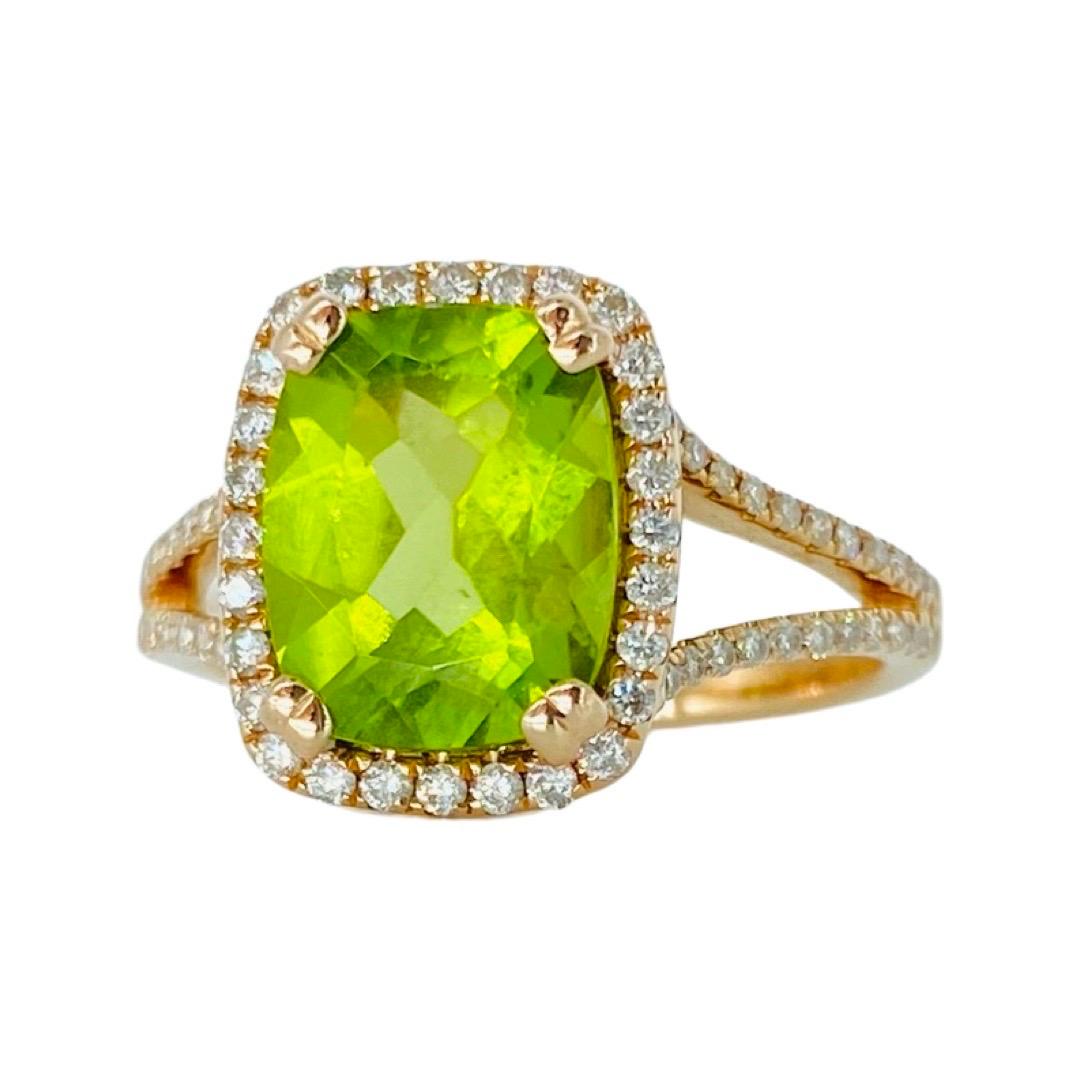 3.80 Carat Peridot and 0.50 Carat Diamonds 14k Rose Gold Halo Engagement Ring.
Elegant halo diamond ring made in 14 karat solid rose gold and features a center Peridot gemstone weighing approx 3.80 carat surounded by 72 diamonds weighting approx