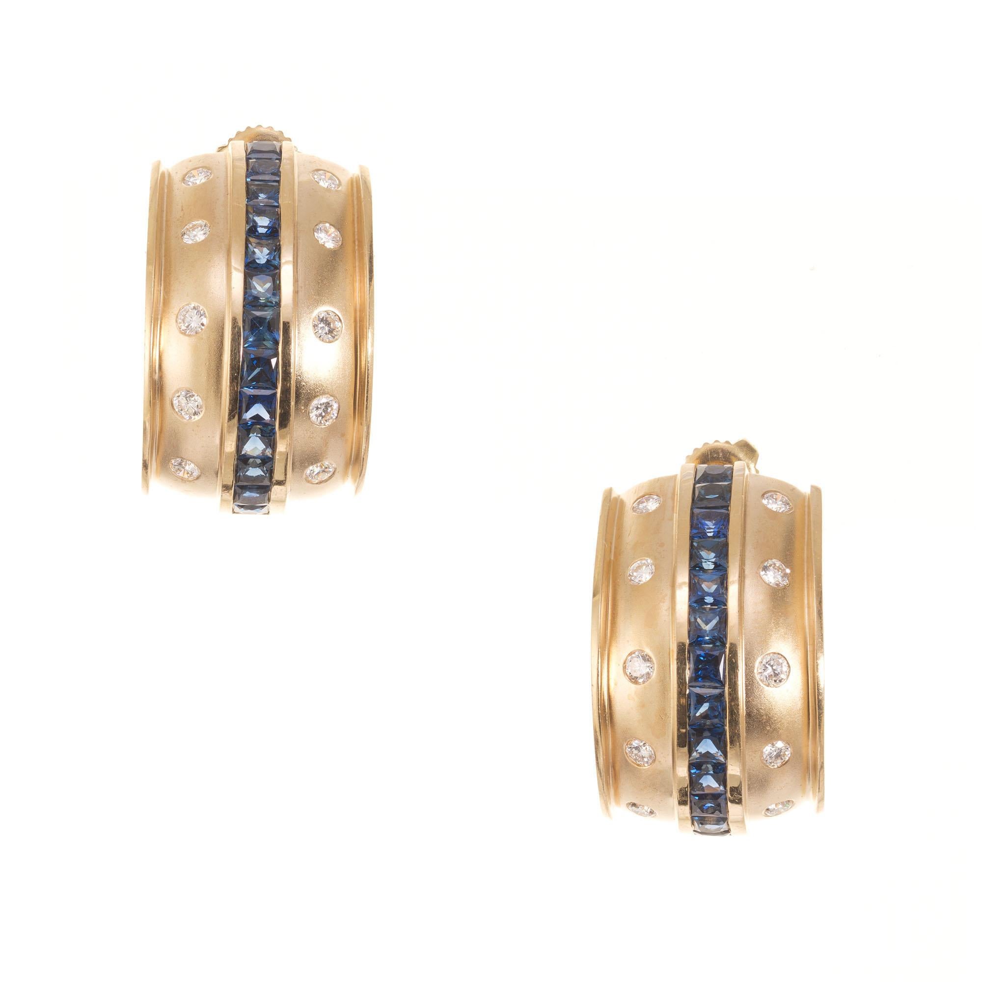 1970's Diamond and sapphire half hoop earrings. 26 square cut sapphires accented with 20 round cut diamonds set in 14k yellow gold.

20 round diamonds approx. total weight. 0.80cts.  H-I SI
26 square cut sapphires, approx. total weight. 3.00cts.