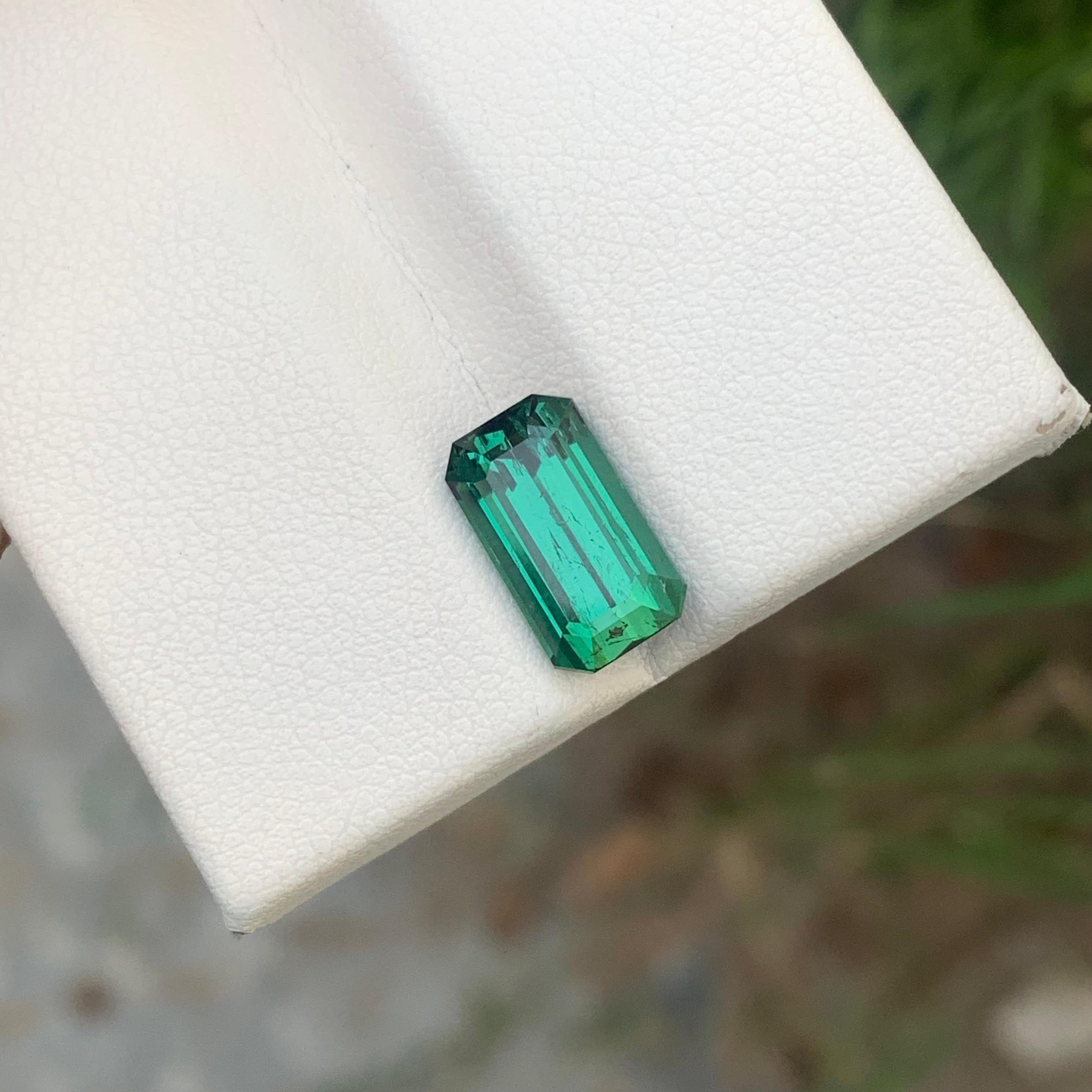 Loose Tourmaline 
Weight: 3.80 Carats 
Dimension: 11.5x6.6x5.7 Mm
Origin: Kunar Afghanistan 
Shape: Emerald 
Color: Lagoon Green
Treatment: Non
Certificate: On Demand 
Lagoon tourmaline, a captivating member of the tourmaline family, derives its