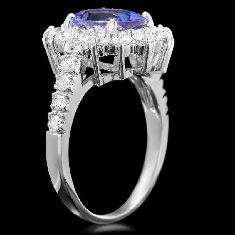 3.80 Carats Natural Tanzanite and Diamond 18K Solid White Gold Ring

Total Natural Tanzanite Weight is: Approx. 2.90 Carats 

Tanzanite Measures: Approx. 10.00 x 8.00mm

Natural Round Diamonds Weight: Approx. 0.90 Carats (color G-H / Clarity