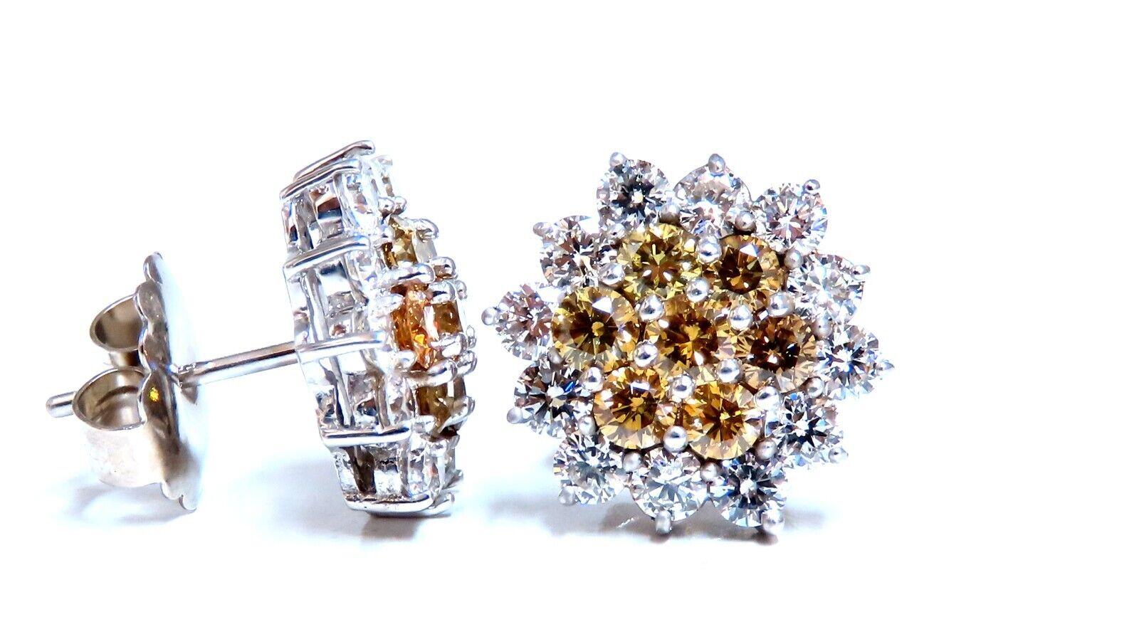 Cluster Stud Earrings

2.14ct. Natural White Diamonds

 Rounds, full cuts

G-color, Vs-2 clarity.

1.66ct Natural Yellow Orange Brown diamonds.

Vs-2 Si-1 Clarity

Overall: .50 Inch wide

14kt. white gold. 

comfortable and secure butterfly