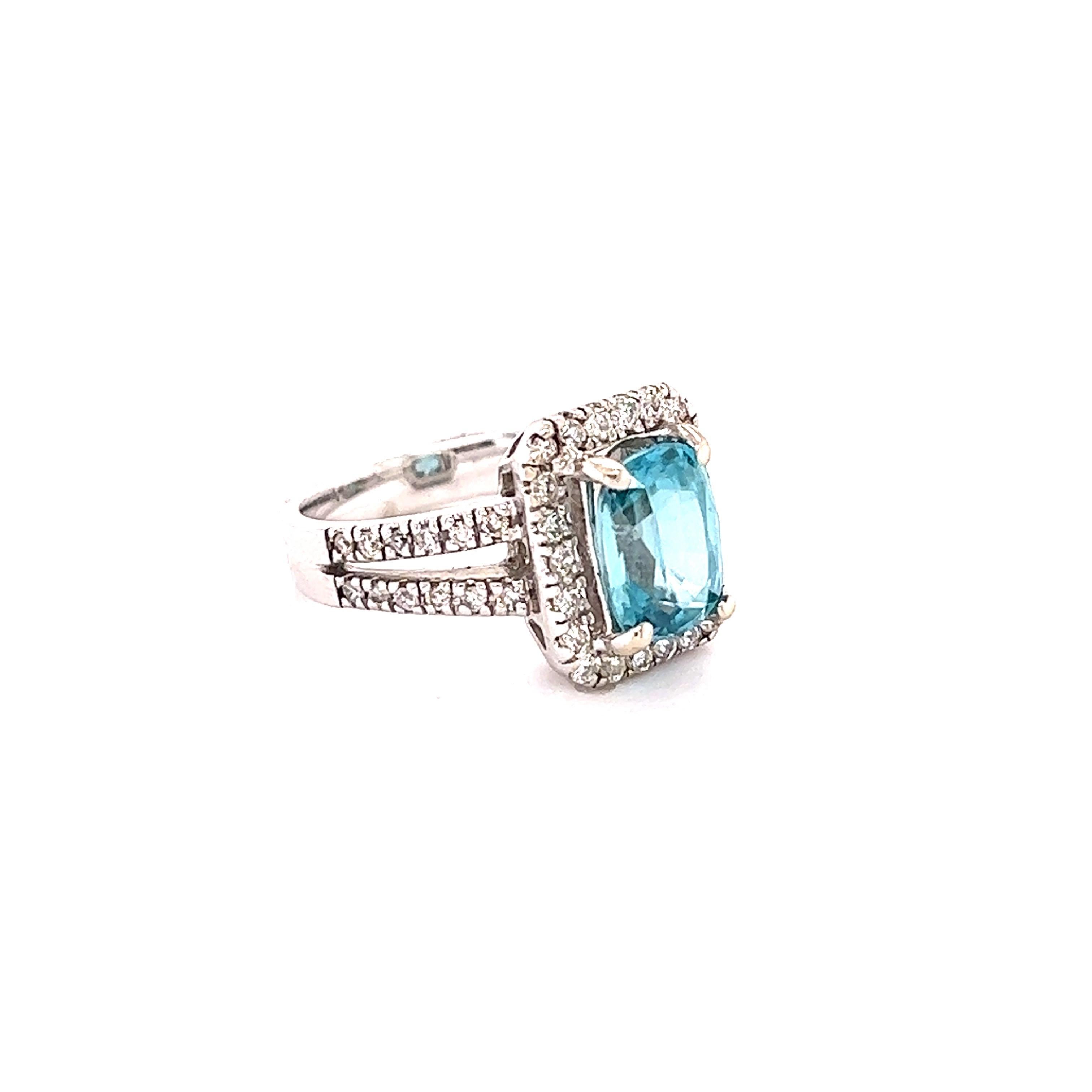 Blue Zircon is a natural stone mined mainly in Sri Lanka, Myanmar, and Australia.  
This ring has a Oval Cushion Cut Blue Zircon that weighs 3.21 carats and is surrounded by 46 Round Cut Diamonds that weigh 0.60 Carats. The total carat weight of the