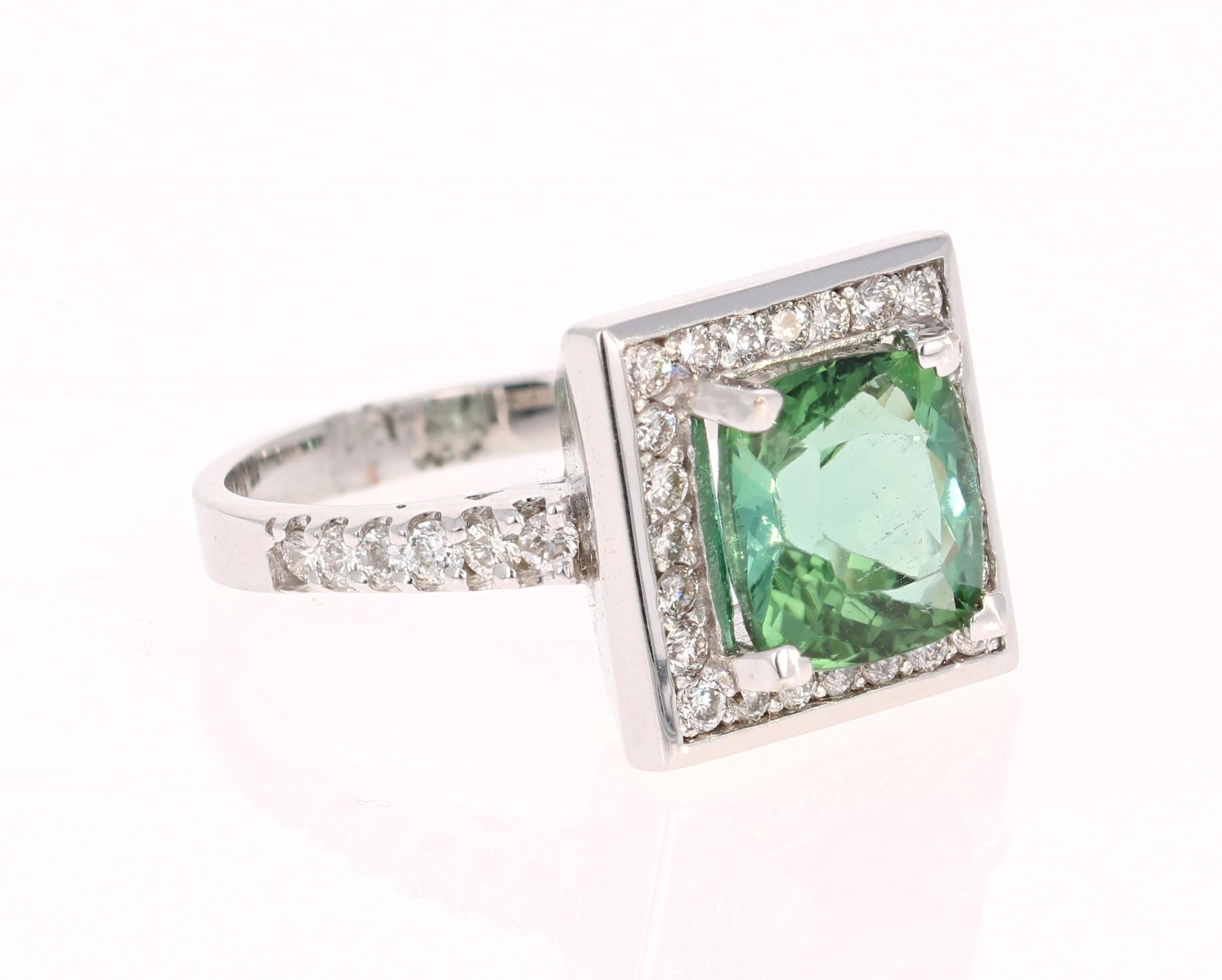 This ring has a magnificently beautiful Cushion Cut Green Tourmaline that weighs 3.14 Carats and has 36 Round Cut Diamonds weighing 0.67 Carats with a clarity and color of VS-F. The total carat weight of the ring is 3.81 Carats.

The ring is made in