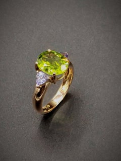 3,61 Karat Peridot Tansanit Dreistein-Ring aus Roségold