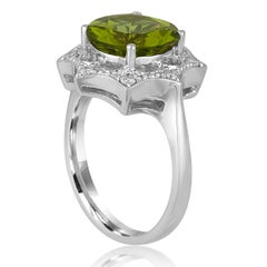 Goldring mit 3,81 Karat rundem Peridot und Diamant