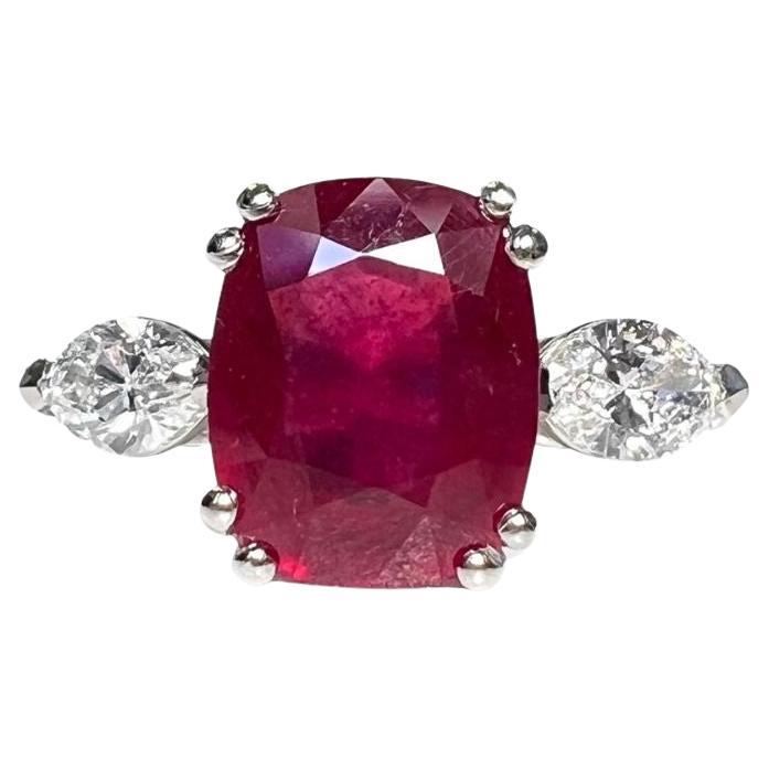 3.81 Carat Ruby Cushion Three Stone Ring Marquise Diamonds For Sale