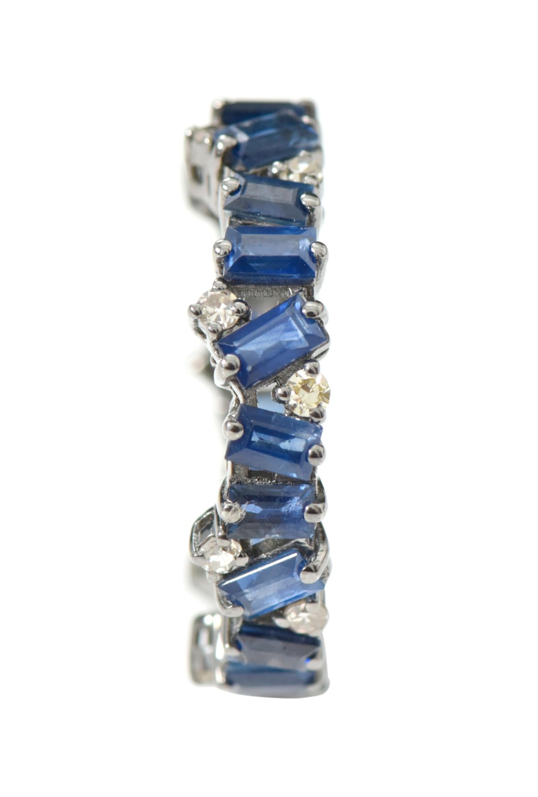 3.82 Carat Baguette-Cut Blue Sapphire and Diamond Eternity Band Ring in Victorian Style

This gorgeous navy blue sapphire and diamond band is sensational. The solitaire distinctly angled mix baguette-emerald cut sapphire in two-center prong setting