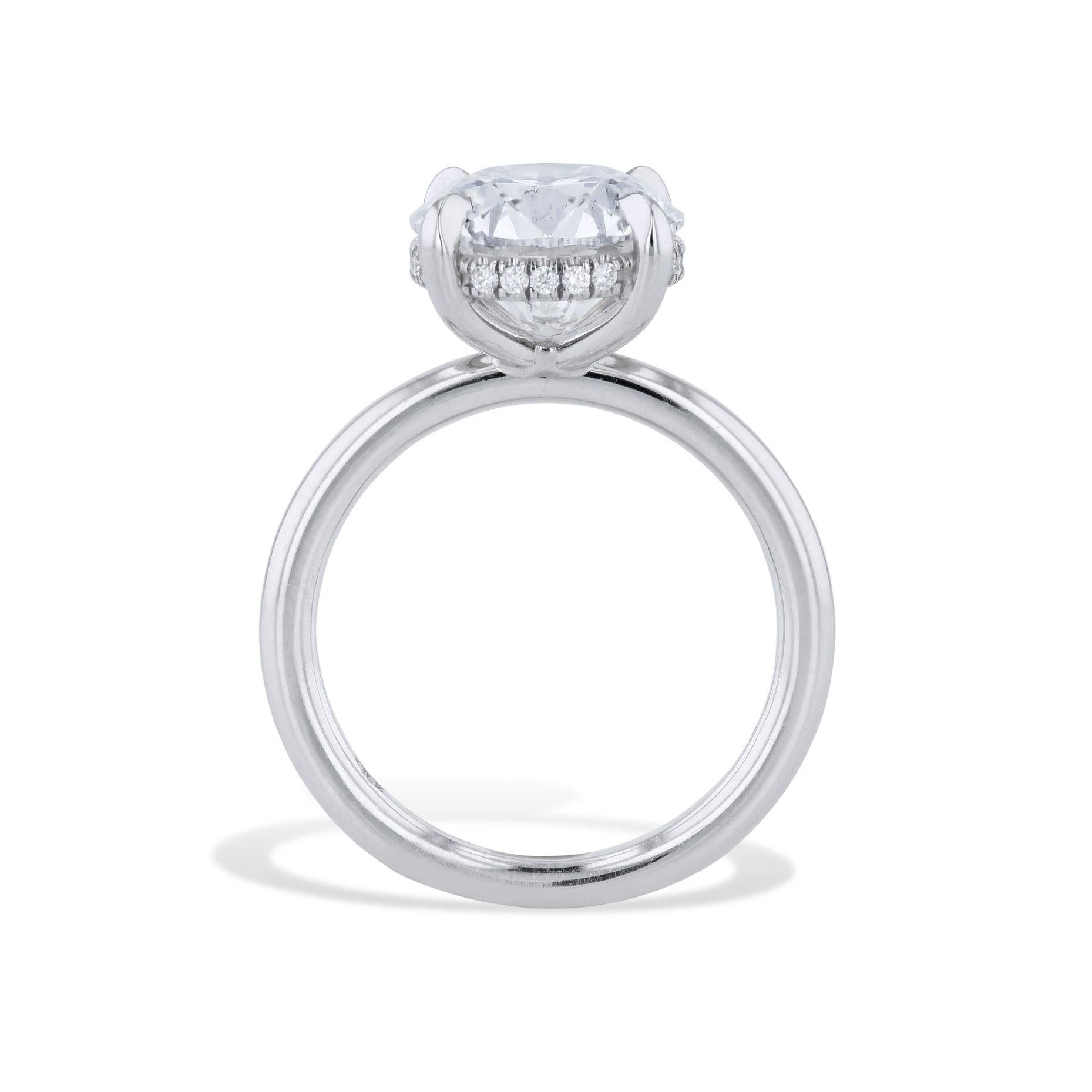 This stunning 3.82 Carat Round Diamond Platinum Engagement Ring will make her heart skip a beat! Featuring a certified center diamond and hand-crafted Diamond Pave under the basket, this ring from the H&H Collection is a beautiful testament to your
