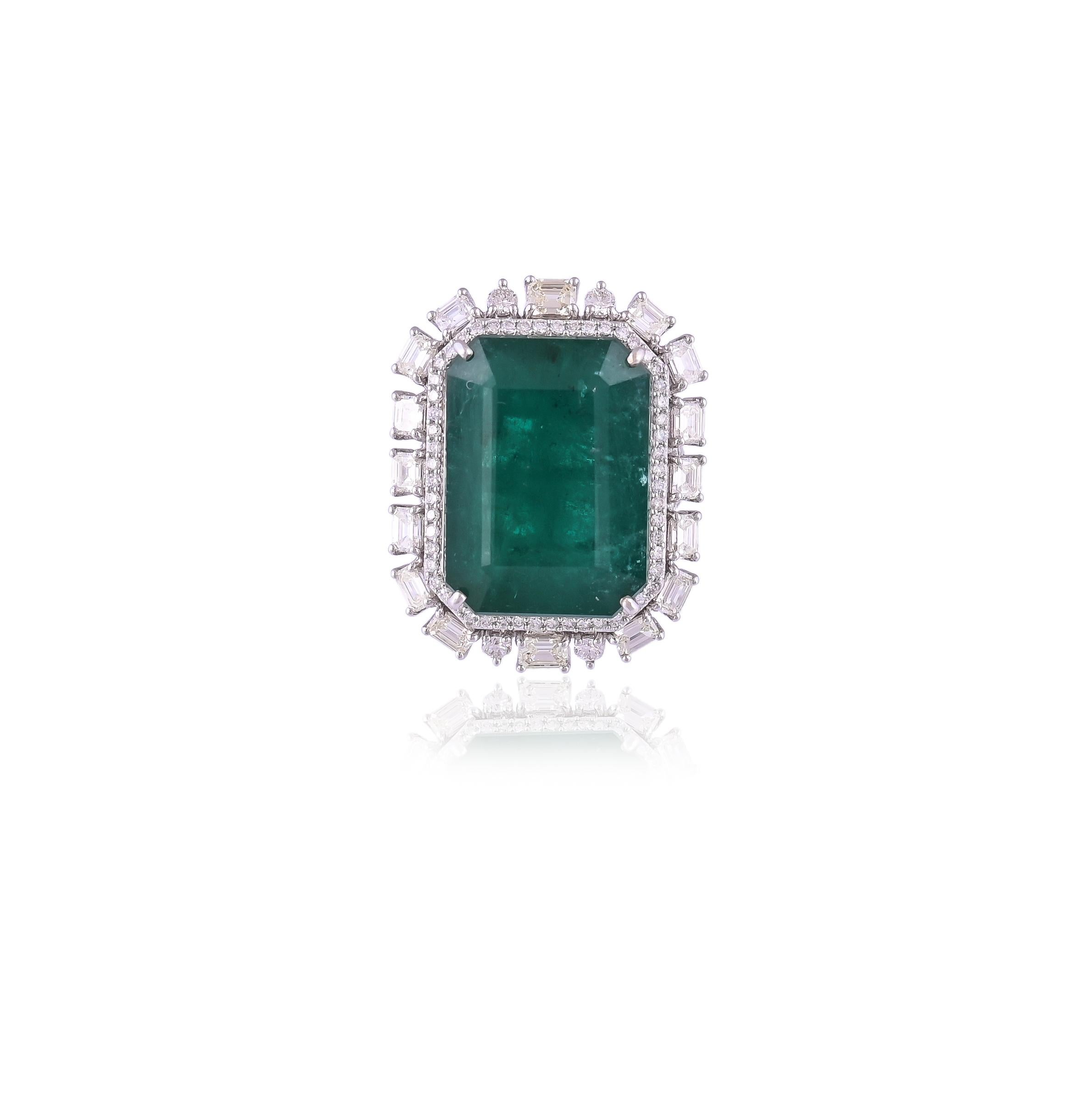 A very beautiful and one of  kind, Emerald Cocktail/Engagement Ring set in 18K Gold & Diamonds. The weight of the Emerald is 38.26 carats. The Emerald is of Zambian origin and is completely natural without any treatment. The weight of the Diamonds