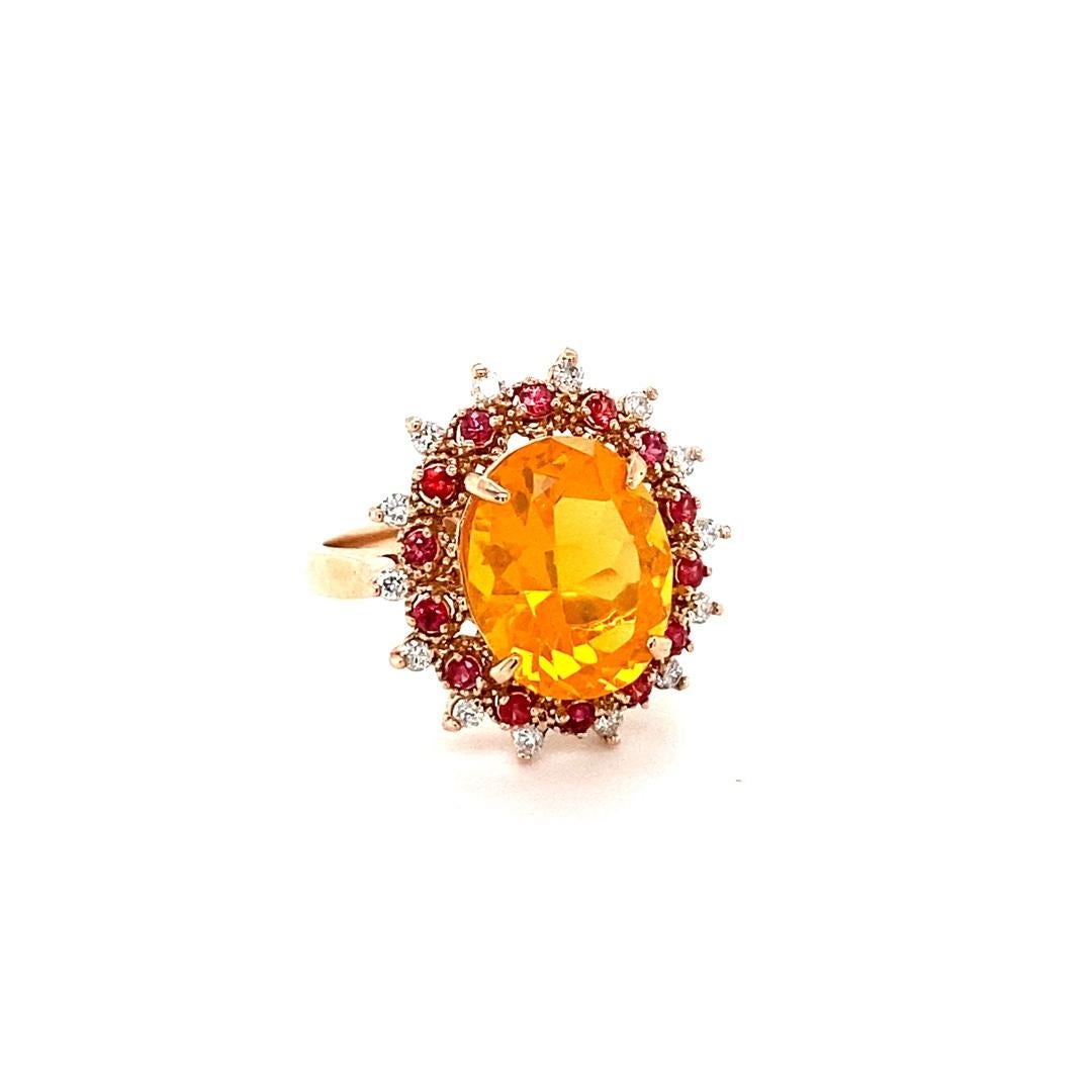 3.83 Carat Oval Cut Fire Opal Sapphire Diamond Yellow Gold Cocktail Ring

This ring has a 3.32 Carat Oval Cut Orange Fire Opal as its center stone and is elegantly surrounded by 14 Round Cut Red Sapphires that weigh 0.30 carats and 14 Round Cut