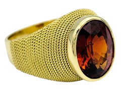 3.83 Carat Oval Cut Spessartite Garnet Ring in Textured 18 Karat Yellow Gold