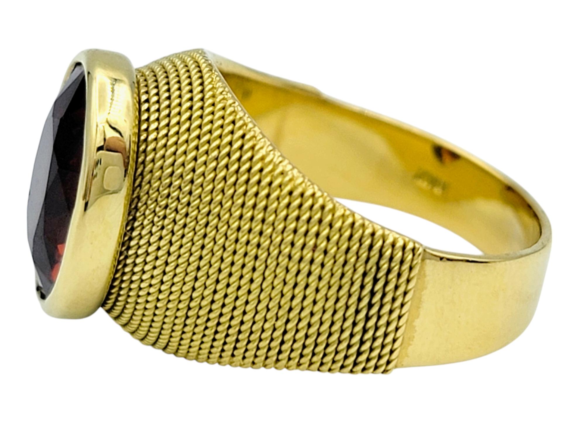 Contemporary 3.83 Carat Oval Cut Spessartite Garnet Ring in Textured 18 Karat Yellow Gold For Sale