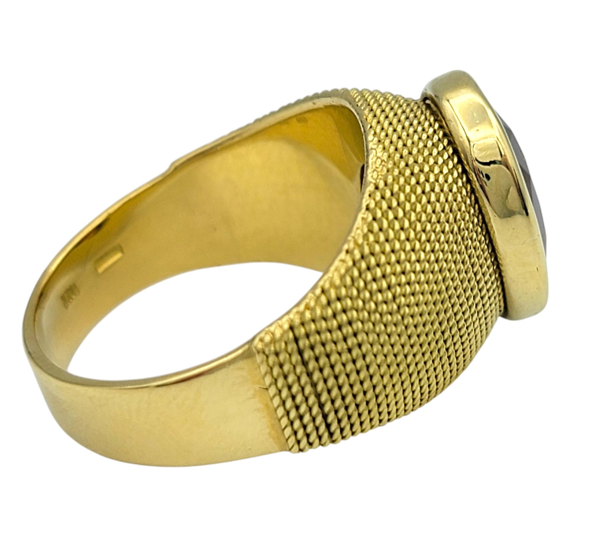 3.83 Carat Oval Cut Spessartite Garnet Ring in Textured 18 Karat Yellow Gold In Good Condition For Sale In Scottsdale, AZ