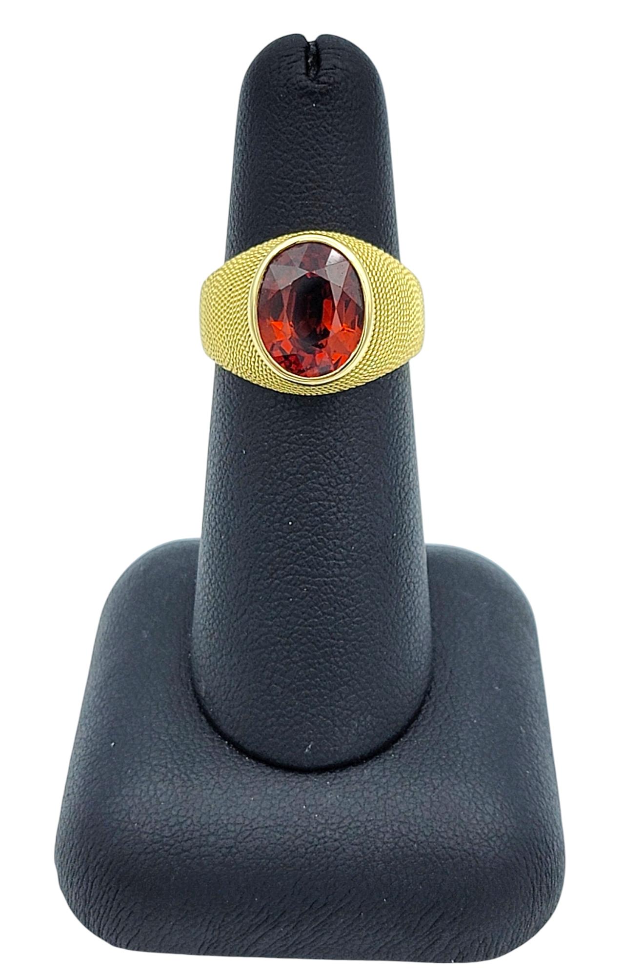 3.83 Carat Oval Cut Spessartite Garnet Ring in Textured 18 Karat Yellow Gold For Sale 4