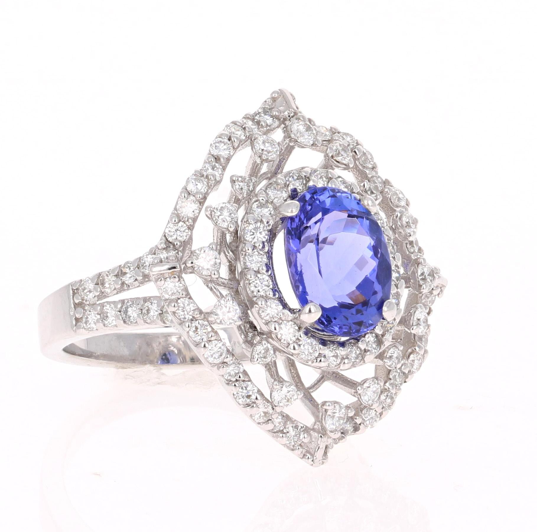 This gorgeous ring has a 2.60 Carat Oval Cut Tanzanite that is set in the center of the ring.  The Tanzanite is surrounded by 92 Round Cut Diamonds that weigh 1.23 carats (Clarity: VS2, Color: F)  The total carat weight of the ring is 3.83 carats. 